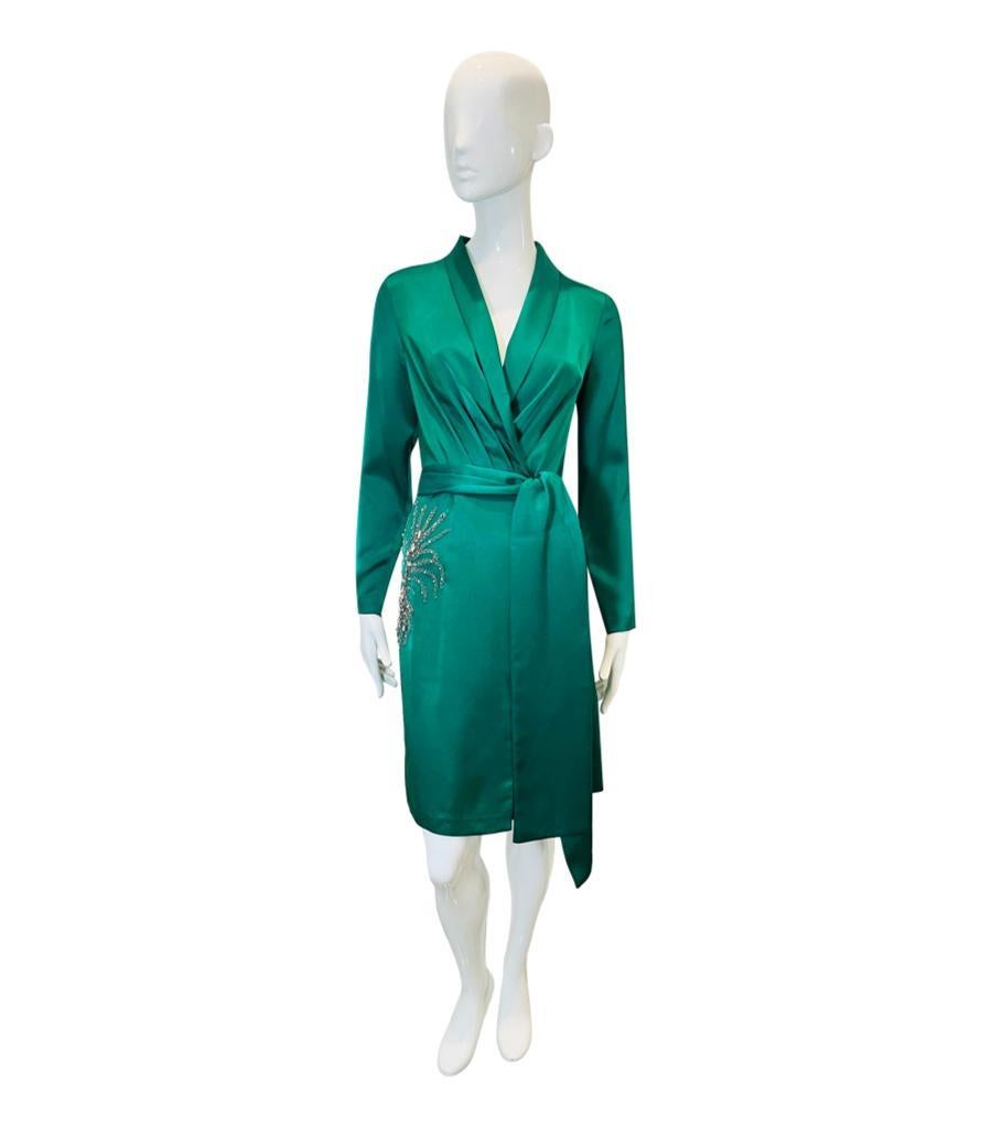 BA&SH Chain & Crystal Embellished Satin Wrap Dress
Emerald green satin dress designed with silver chain and crystal embellishment to the side.
Detailed with wrap V-Neck, tie-up waist and snap button to the cuffs. 
Size – XS
Condition – Good/Very