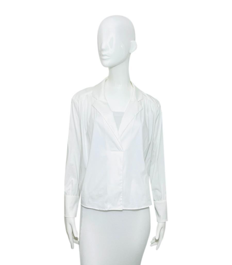 Brand New - BA&SH Cotton Shirt
White 'Dido' shirt designed with deep crossover V-Neck and long puff sleeves with buttoned cuffs.
Featuring pleat detailing to rear and loose silhouette. Rrp £185
Size – 1 - S
Condition – Brand New, With