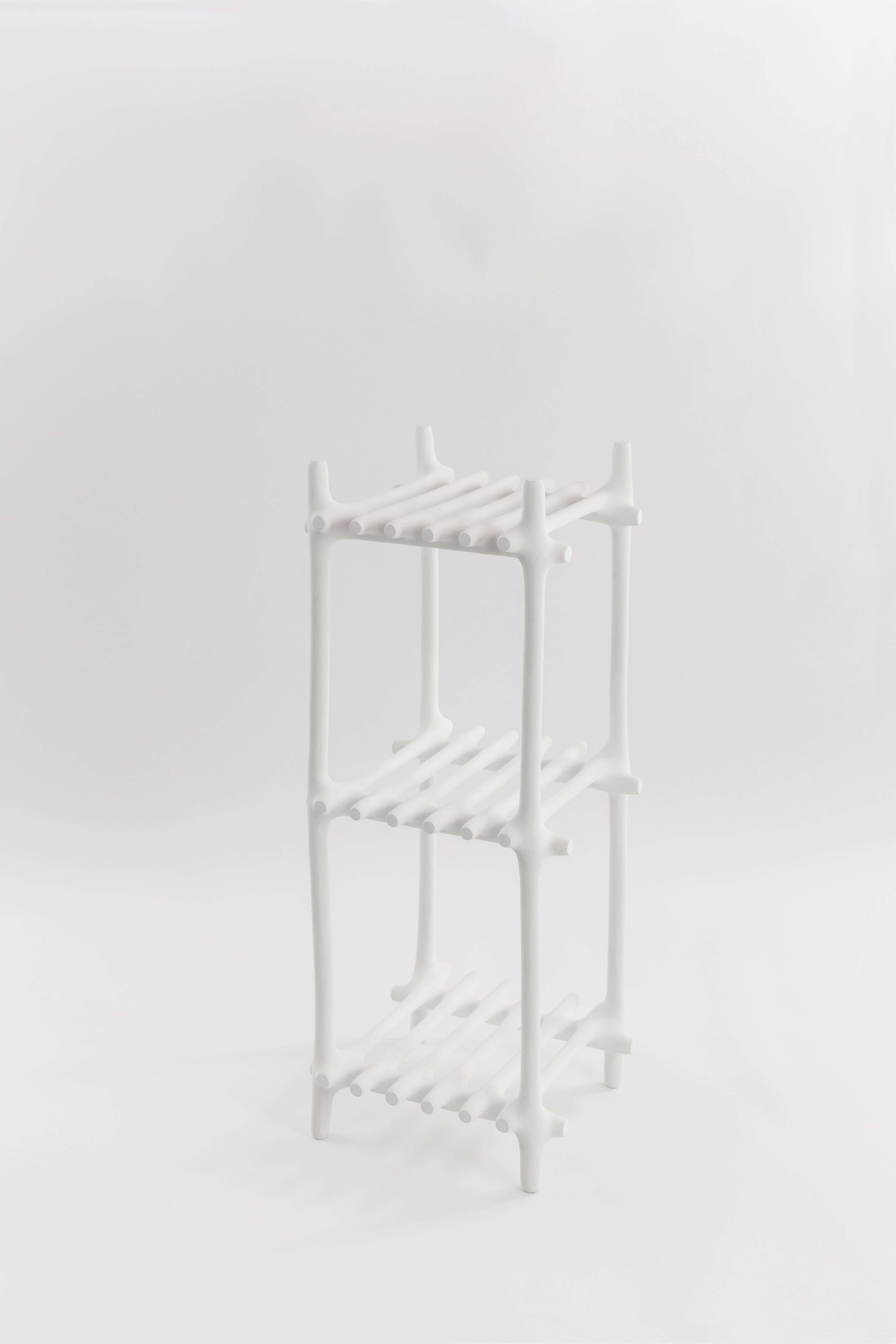 Basic shelf by HWE
Limited edition
Materials: Waste SLS 3D nylon powder, Sand from sustainable sources
Dimensions: H 112 x W 42 x D 42 cm 
Colour: white

Hot Wire Extensions is a young sustainable design brand, presenting a bold innovative