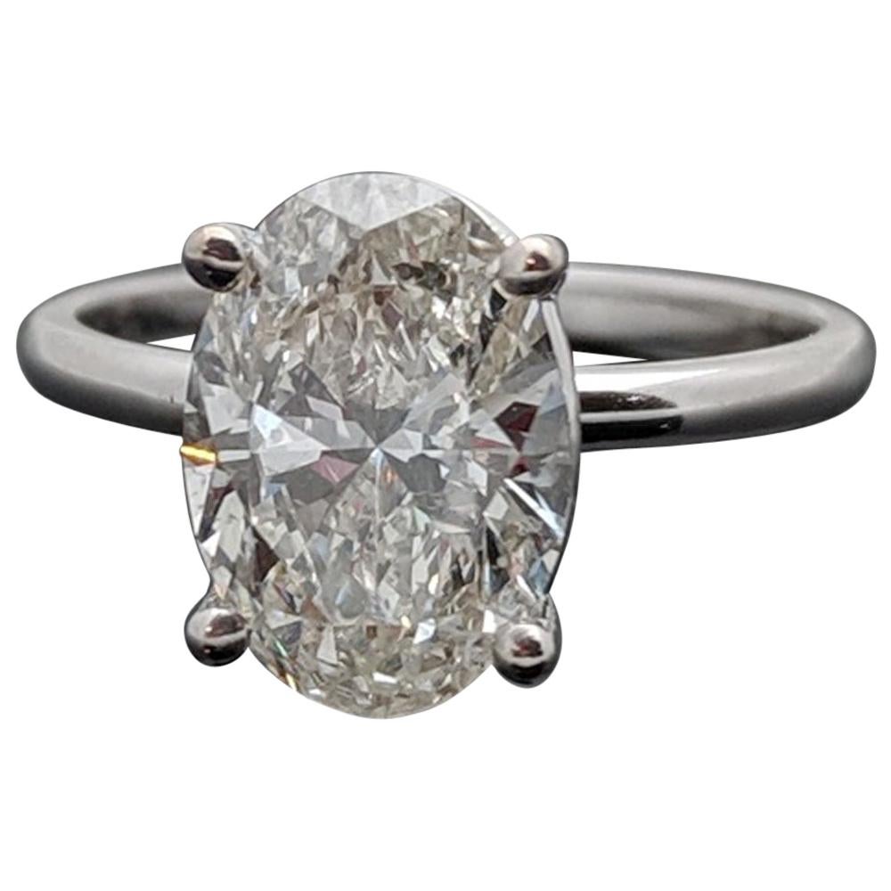 Classic Solitaire Platinum Oval Diamond Ring For Sale