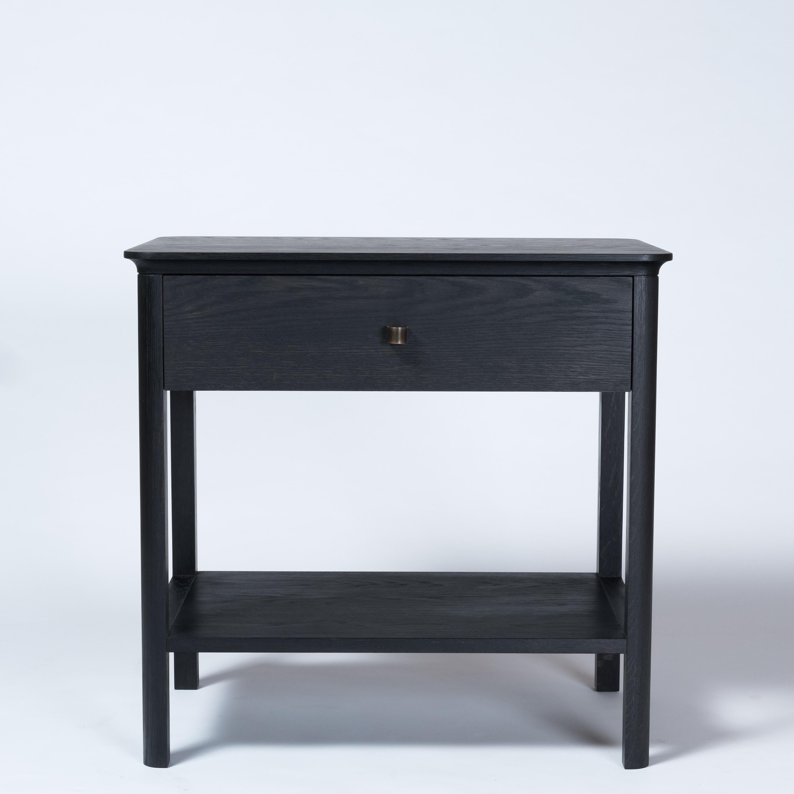 The Basin nightstand combines traditional construction with restrained and refined detailing. The table offers a myriad of uses from a nightstand to a side table. A dovetailed drawer offer concealed storage along with a shelf below. The custom made
