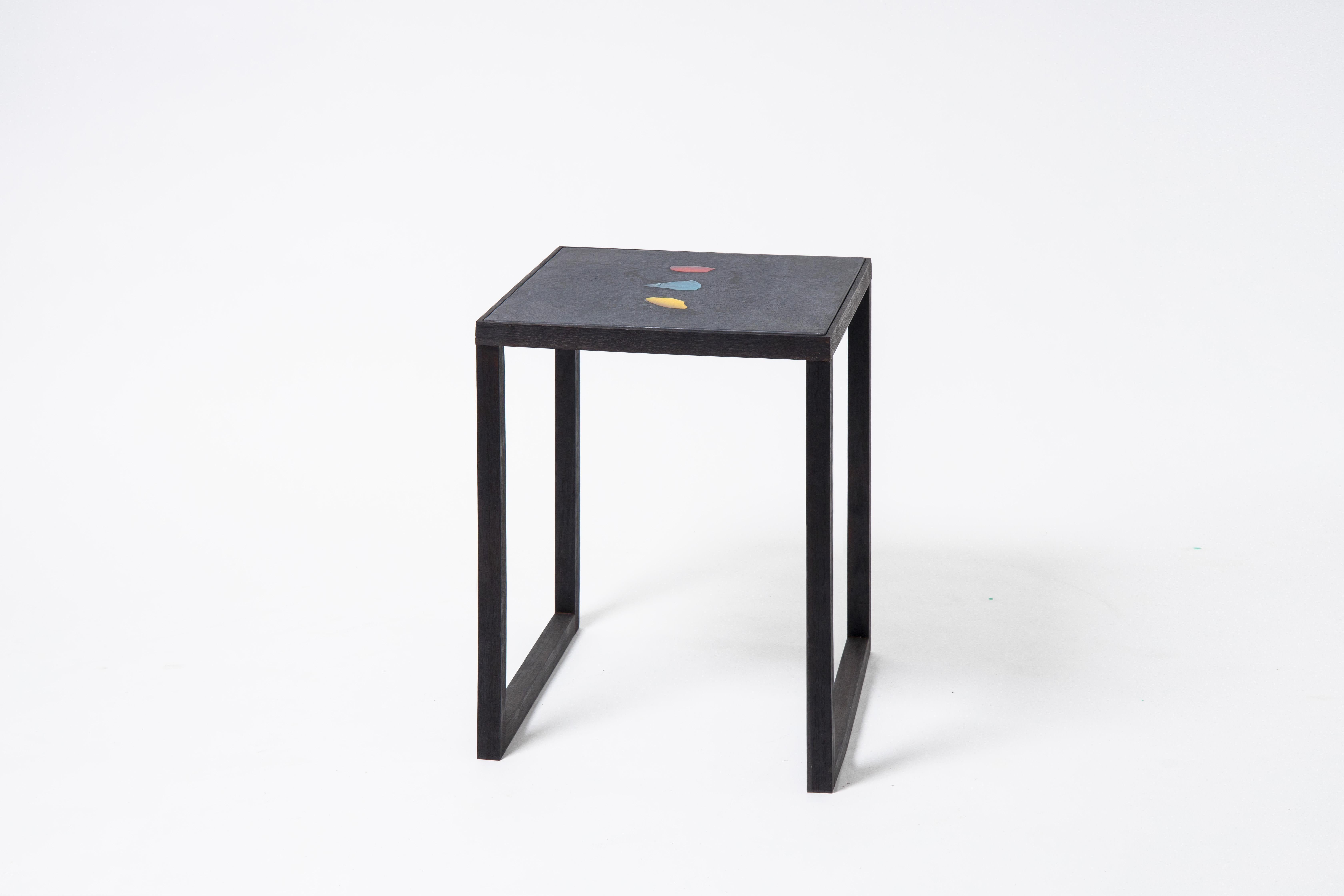 Basis Rho side table by Studio Jeschkelanger
Dimensions: 50 x 50 x 65 cm
Materials: Unique Basis Rho tabletop: lluminated glass, colored concrete
 Oiled Steel frame, handcrafted

Basis Rho was developed by Studio Jeschkelanger. It is understood