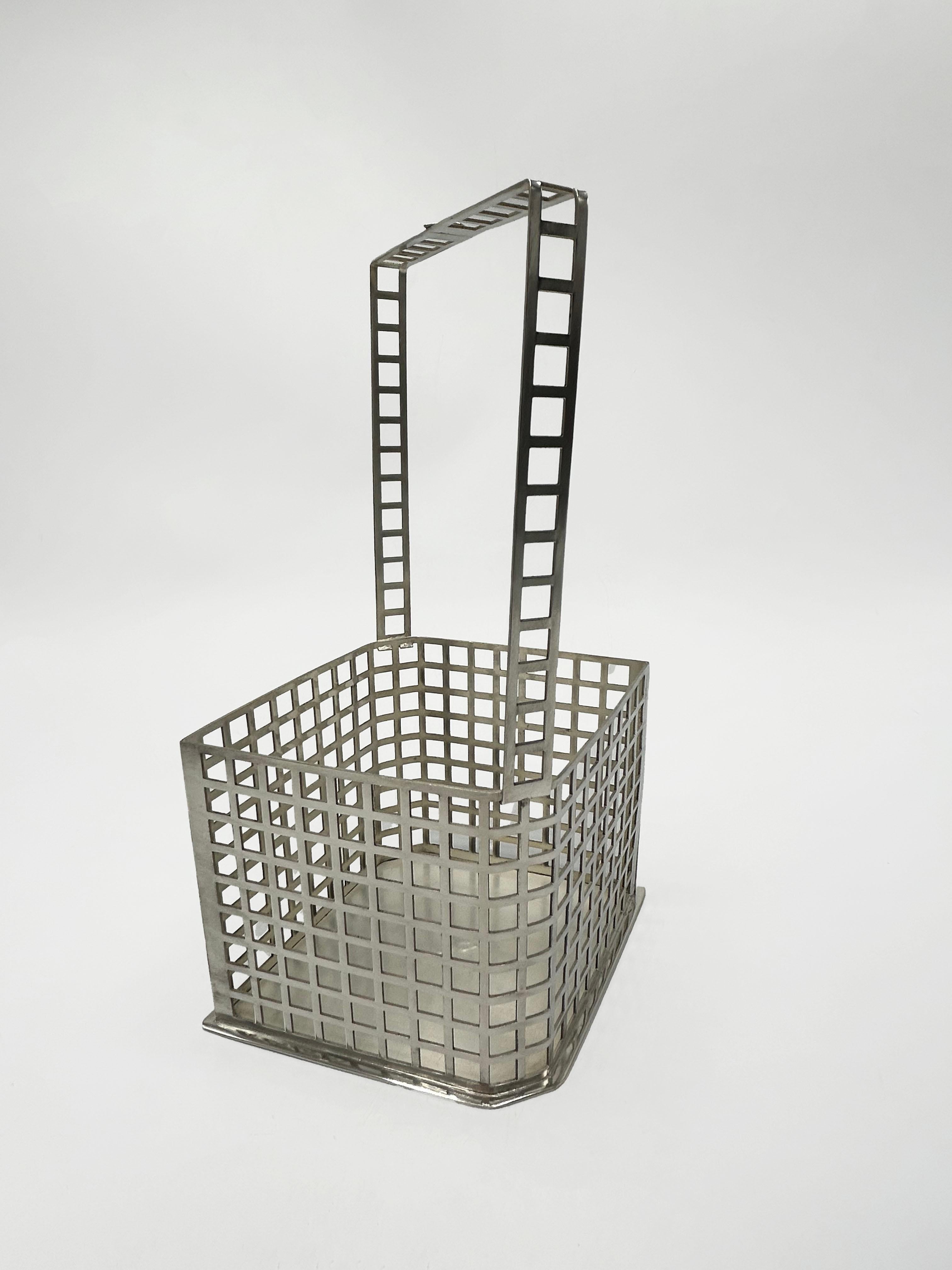 Basket by Josef Hoffmann, Wiener Werkstätte, Vienna, 1906
Silver or silver-plated basket designed by Josef Hoffmann and manufactured by Wiener Werkstätte in Vienna around 1906. The piece features a minimalist, geometric design, characteristic of the