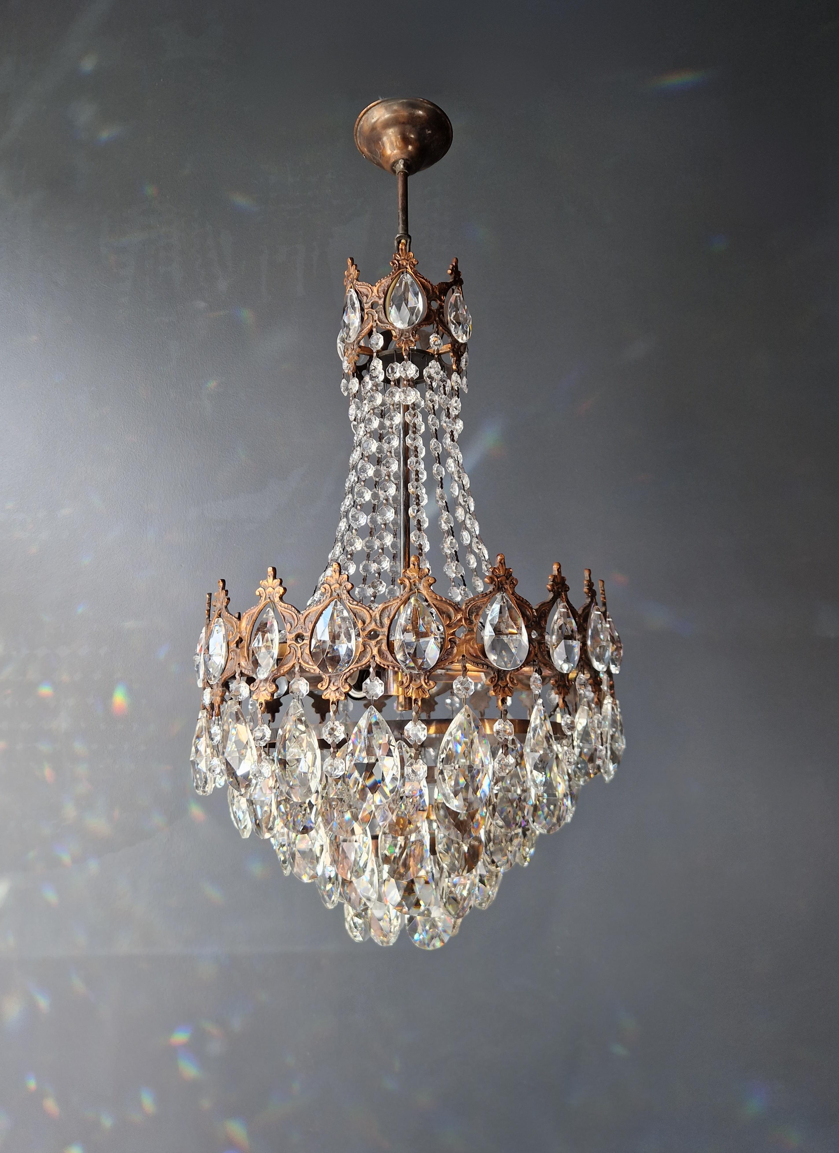 Introducing our beautifully restored old chandelier from Berlin! This exquisite piece has been professionally refurbished with love, making it suitable for use in the US with its rewired electrical system. Not a single crystal is missing, and each