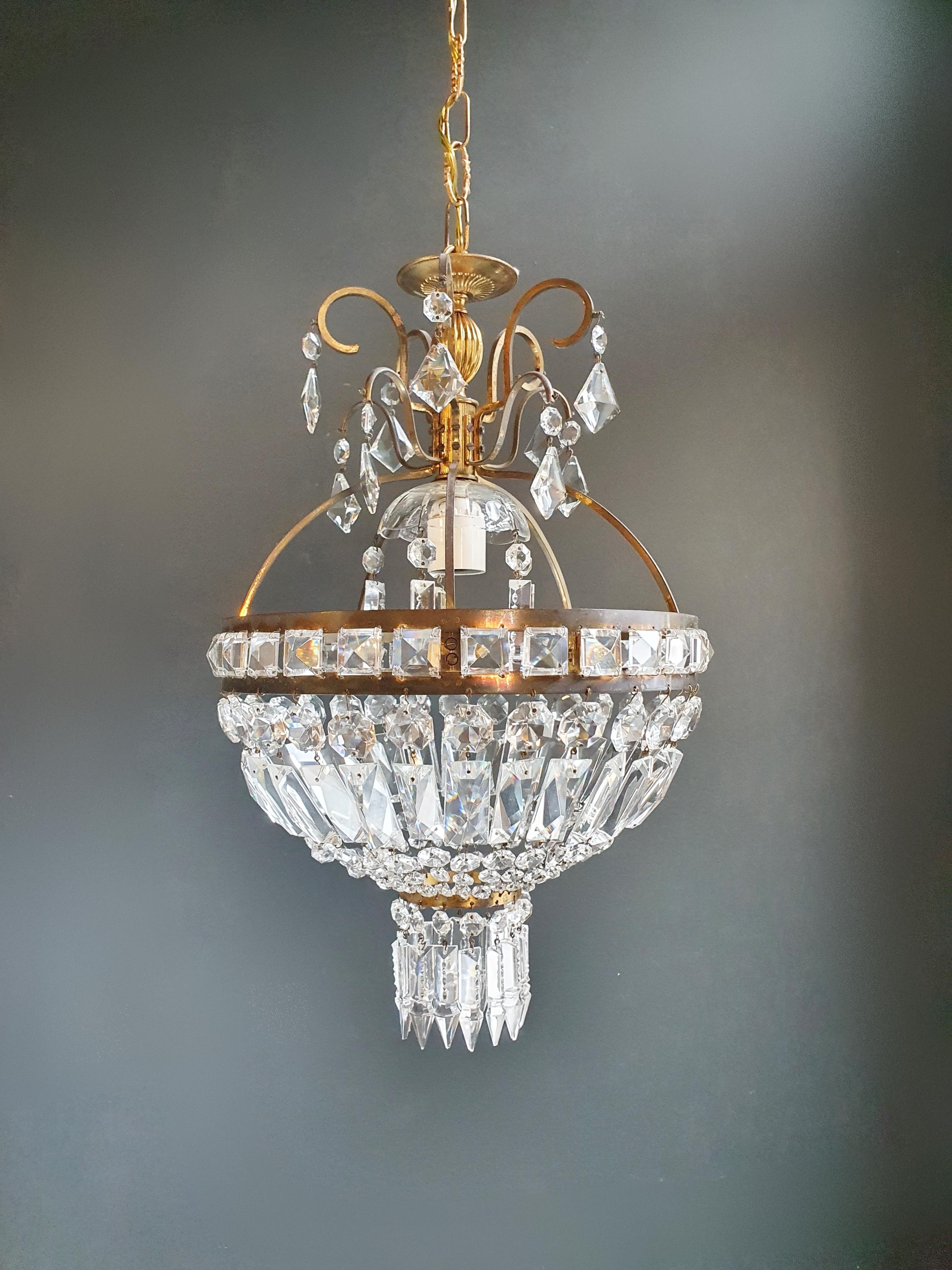 Cabling and sockets completely renewed. Crystal hand knotted
Measures: Total height: 80 cm, height without chain: 50 cm, diameter 30 cm, weight (approximately) 4kg.

Number of lights: 1 -light Bulub sockets: E27
Brass frame.
Total length
