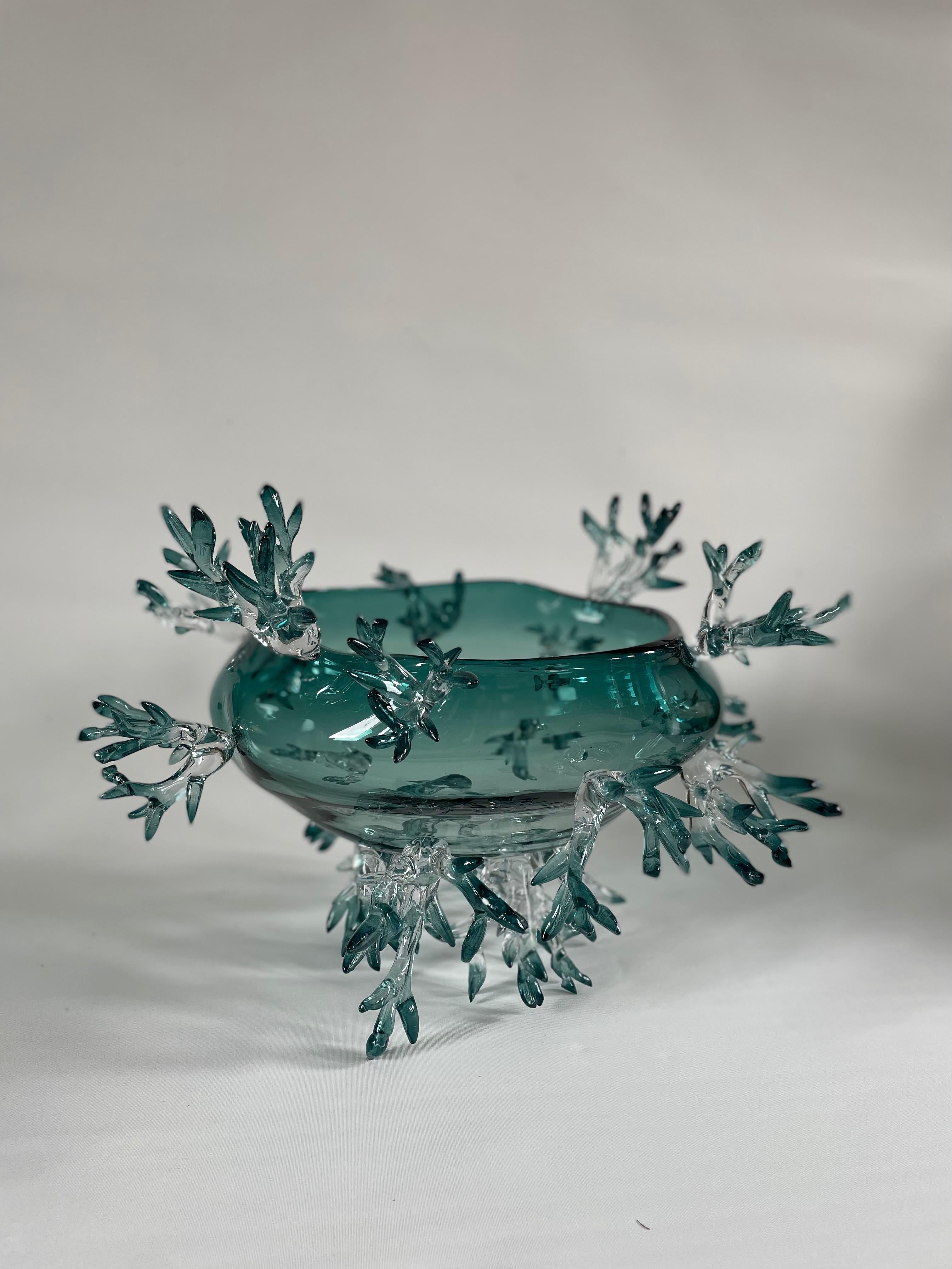 Basket Shape Green Vase by Emilie Lemardeley
Unique Piece
Dimensions: ⌀ 48 x H 38 cm
Materials: Hand blown glass.

DRYADE Collection
All in crystal, these large vases are raised and balanced on thin branches. Each Dryade vase is unique and has a