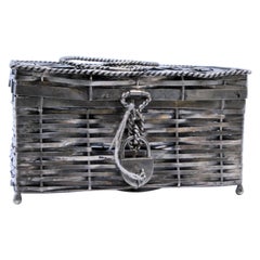 Basket-shaped silver basket w/ handle 
corded trims w/ key lock 
padlock