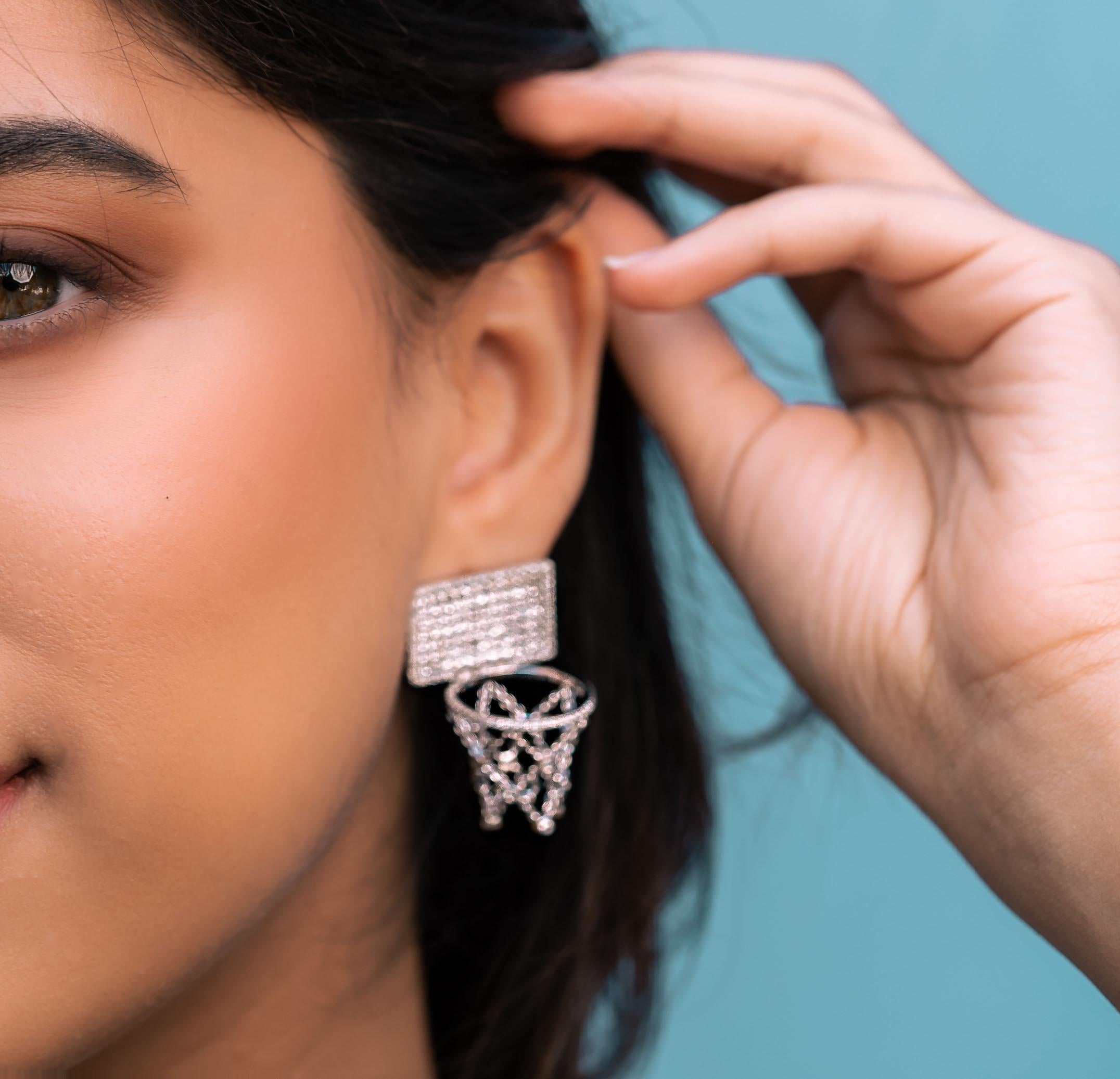 Where movement meets magnificence.
The BASKETBALL Earrings are a sculptural expression of athletic grace and refined luxury. Crafted in radiant 18K white gold and pavé-set with natural VS-clarity diamonds, they reflect the brilliance and energy of