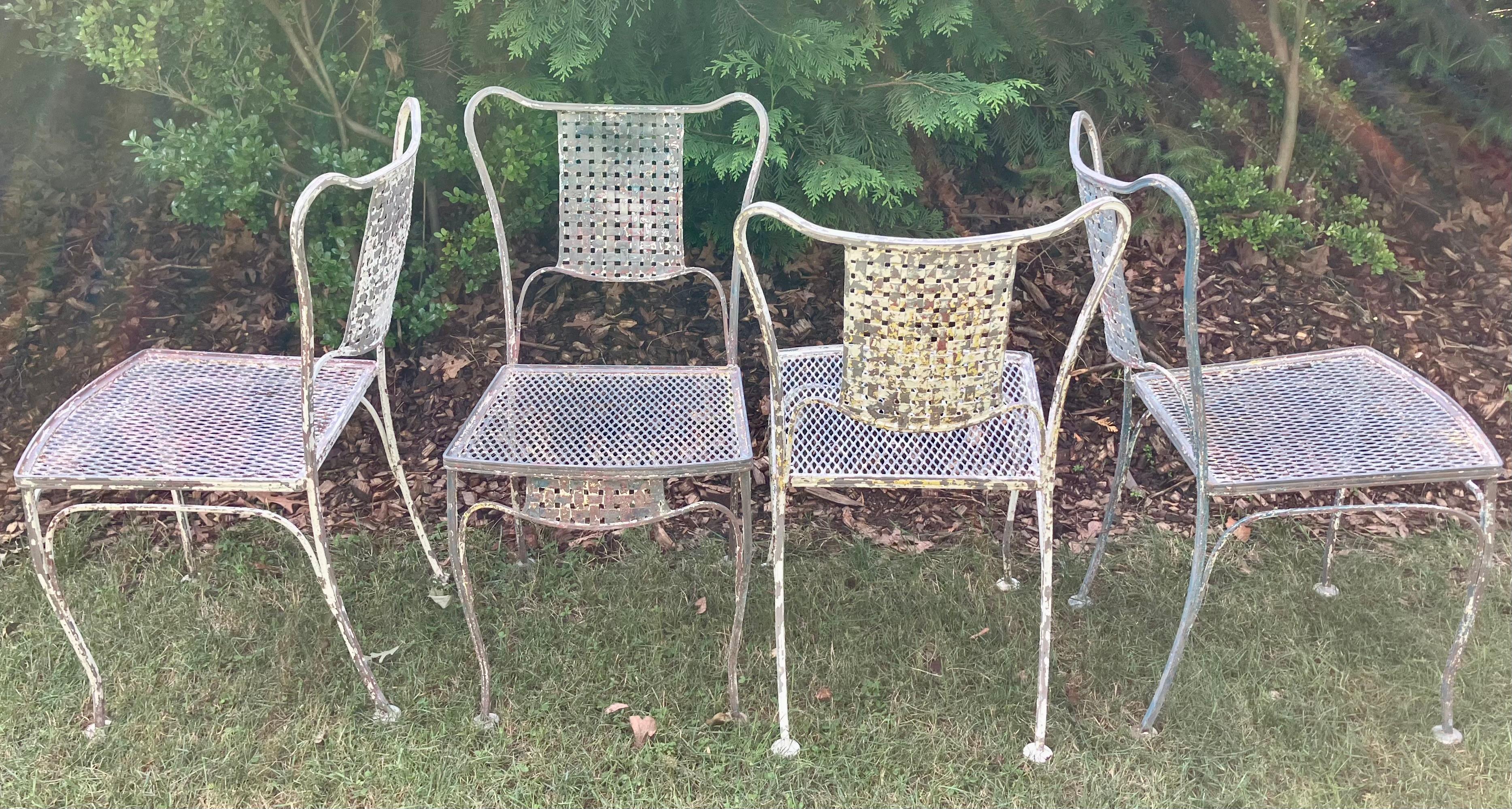 Basketweave iron patio dining chairs. Mid-century vintage grey wrought iron chipped painted side chairs for the terrace. United States, Mid-20th Century

Dimensions: 18