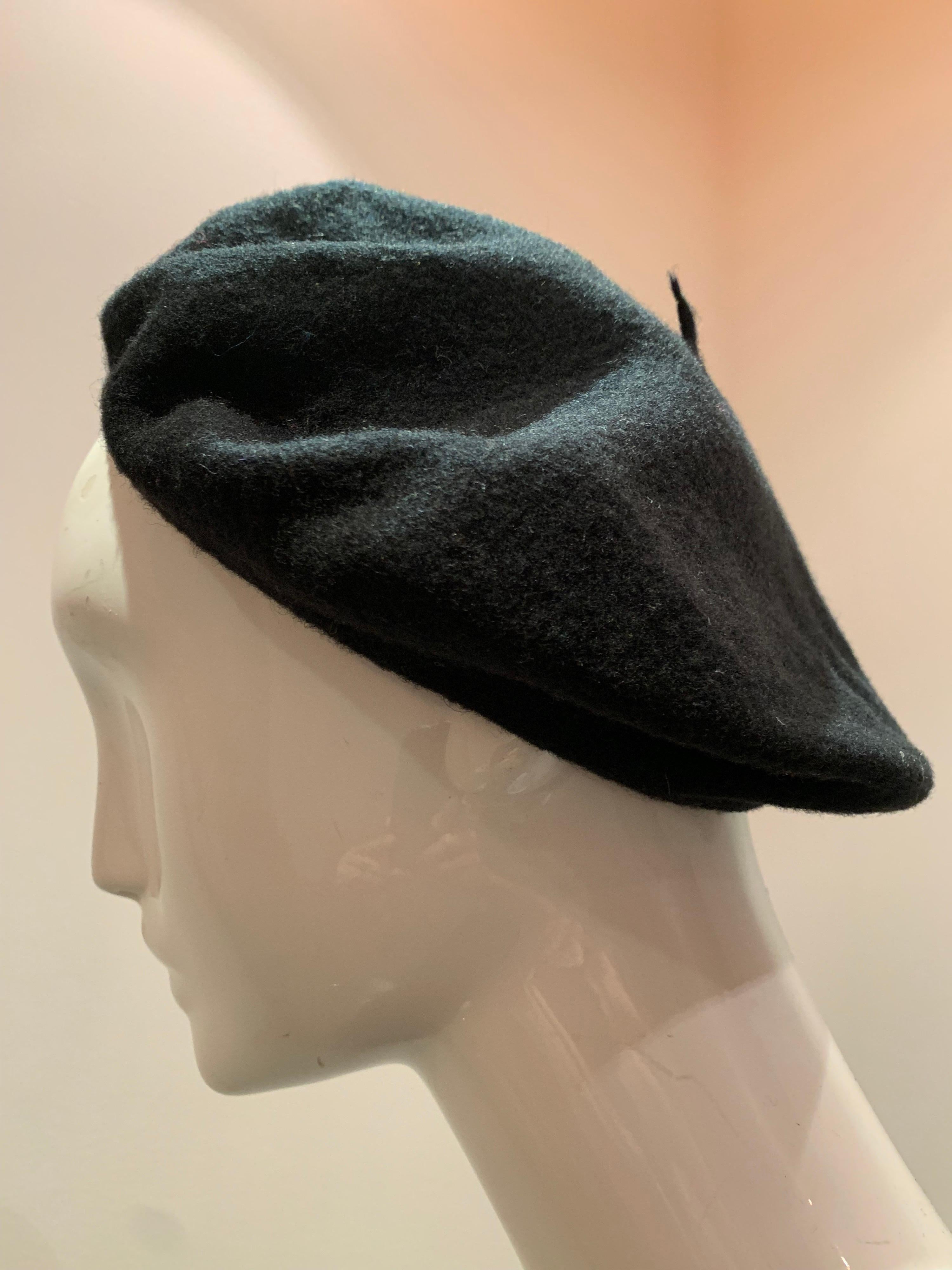 A sleek and simple classic:  A black felted wool beret made in France.  