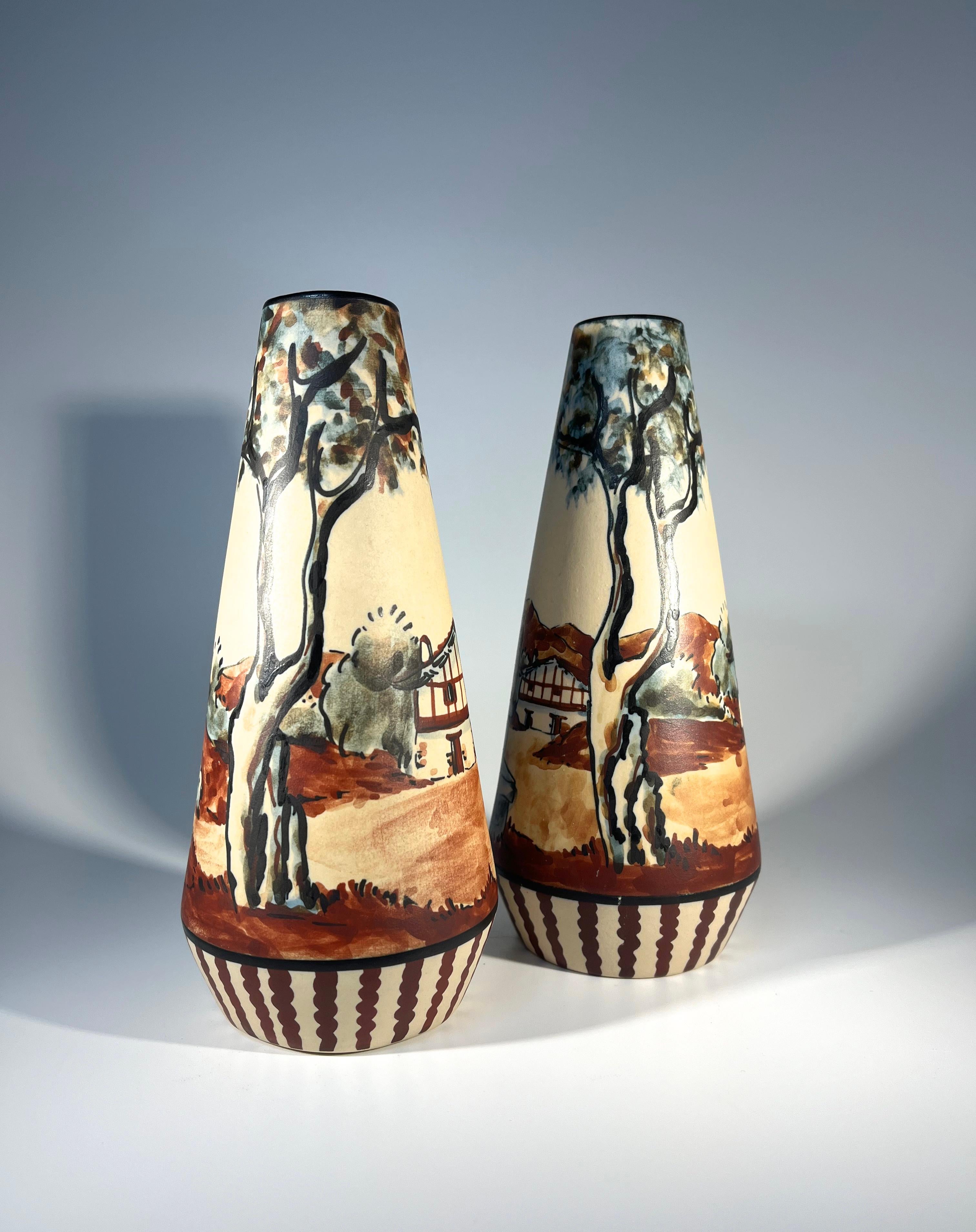 Super pair of typical Ciboure stoneware tapered vases by Anne Marie Grillard for Ciboure, France
Hand decorated with a shepherd tending his flock on one and an animated musician on the other
Albeit a pair, there is a minute difference in