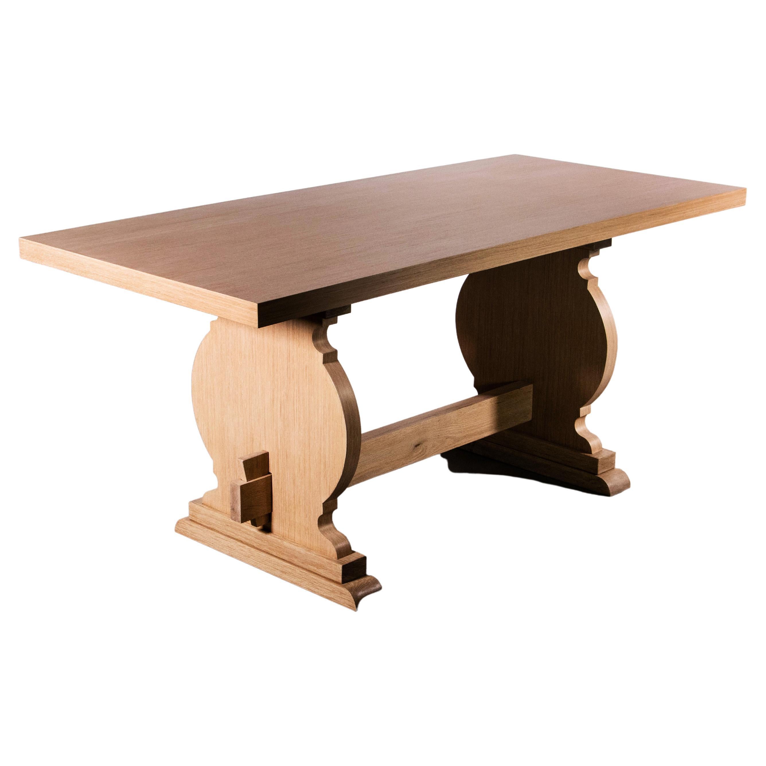 The Manolo table is a modern take on a Basque-inspired trestle base. Shown here in Cerused Oak but available in any wood or finish and in custom sizes. The twin pedestals may be arranged at different points to accommodate your seating configuration.