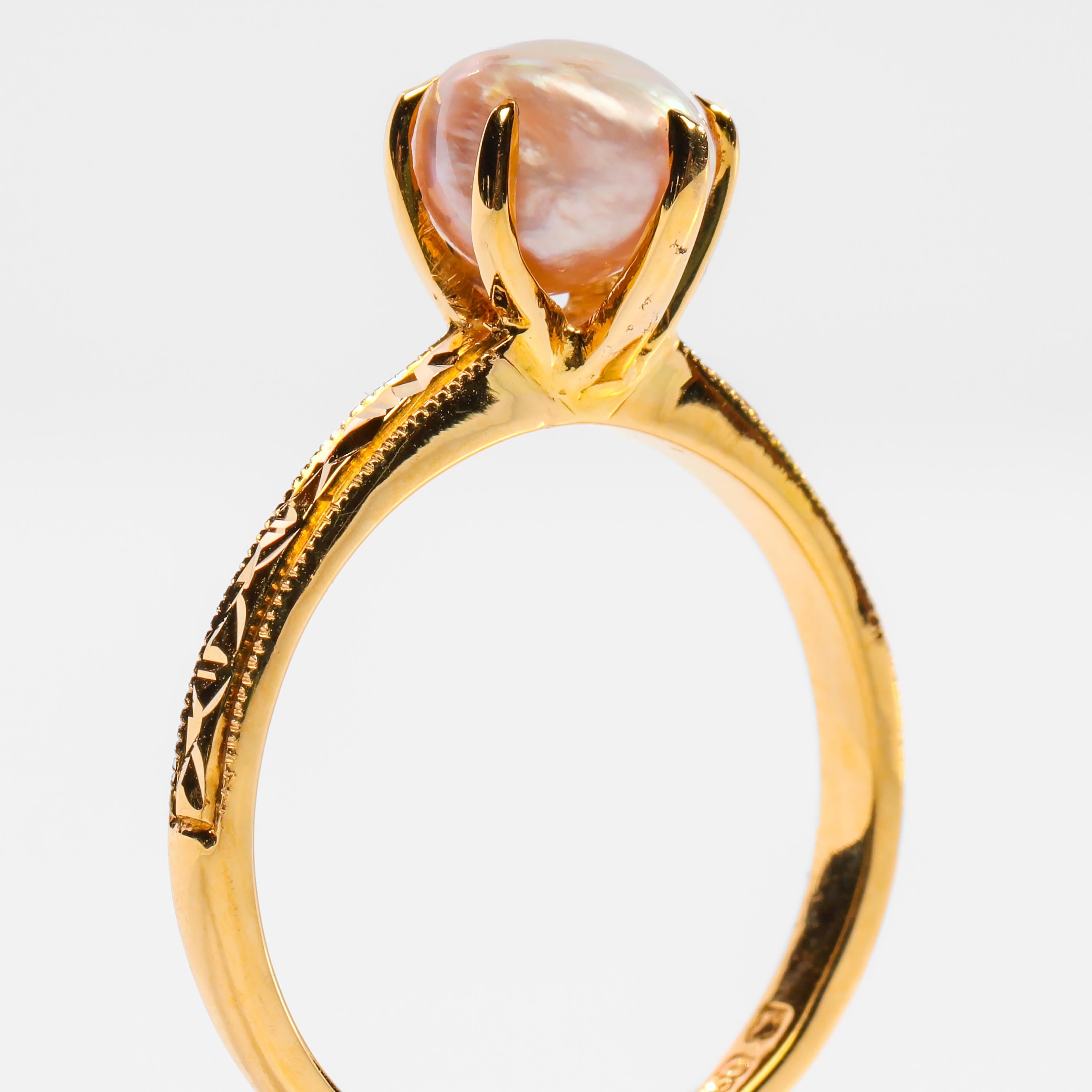 Behold the natural beauty of a fine, certified Basra pearl from the Persian Gulf securely set within six prongs in this buttery, 18K solid yellow gold Victorian style ring. The ring dates to approximately 2010 and has never been worn. But the gold