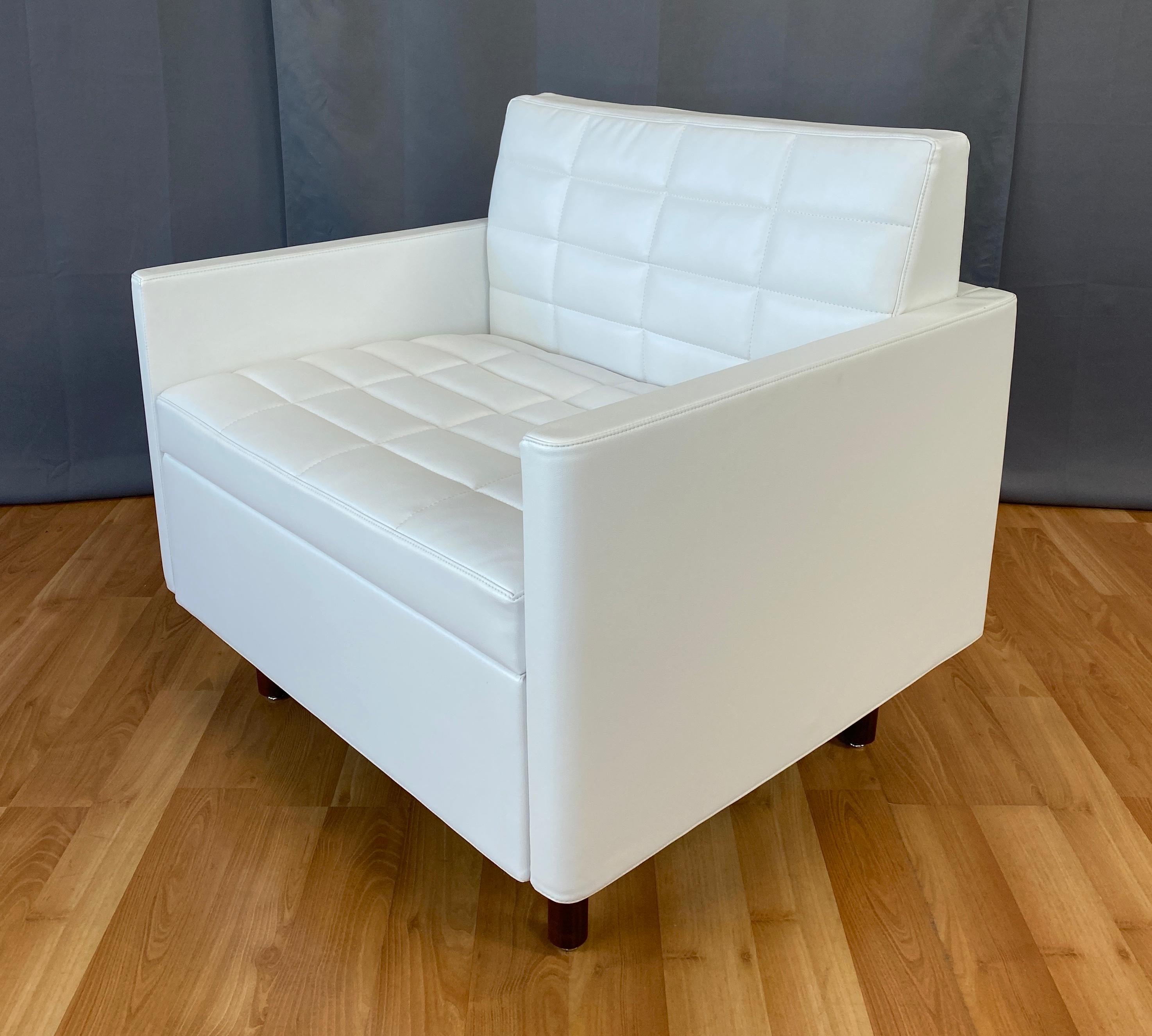 Offered here is a tuxedo Classic club chair quilted, in white leather, designed by BassamFellows (Craig Bassam & Scott Fellows) for Geiger.
A Herman Miller Company.
From Geiger's web site...
