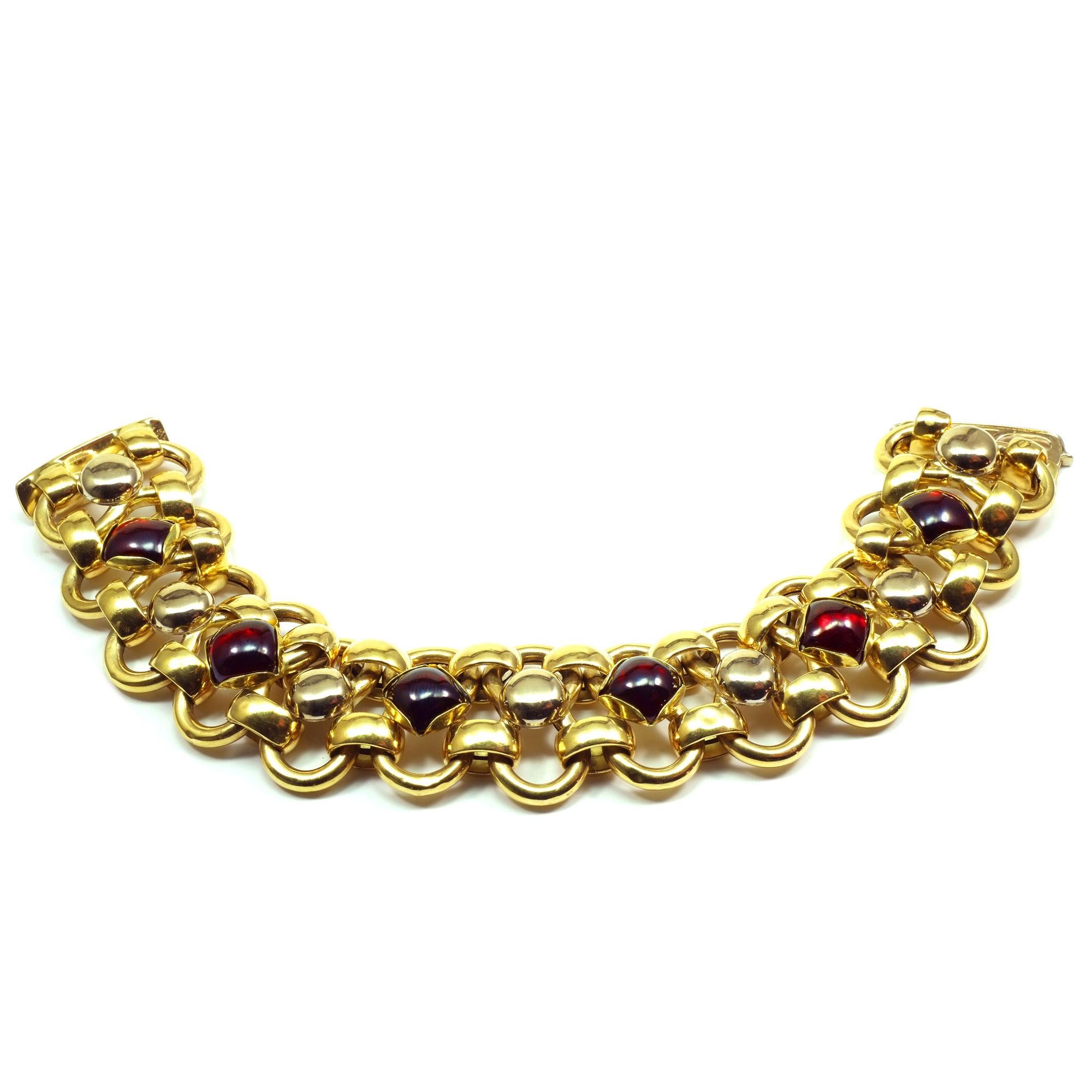Bassani Italian 18K Yellow Gold Almandine Bracelet 

Decorative gold bracelet made of ring-shaped and arched links and set with six deep red almandines.

 

18 K / 750 gold
6 Almandine garnets cabochon carrées, dimensions 9 x9 mm
Size 8 inches long,
