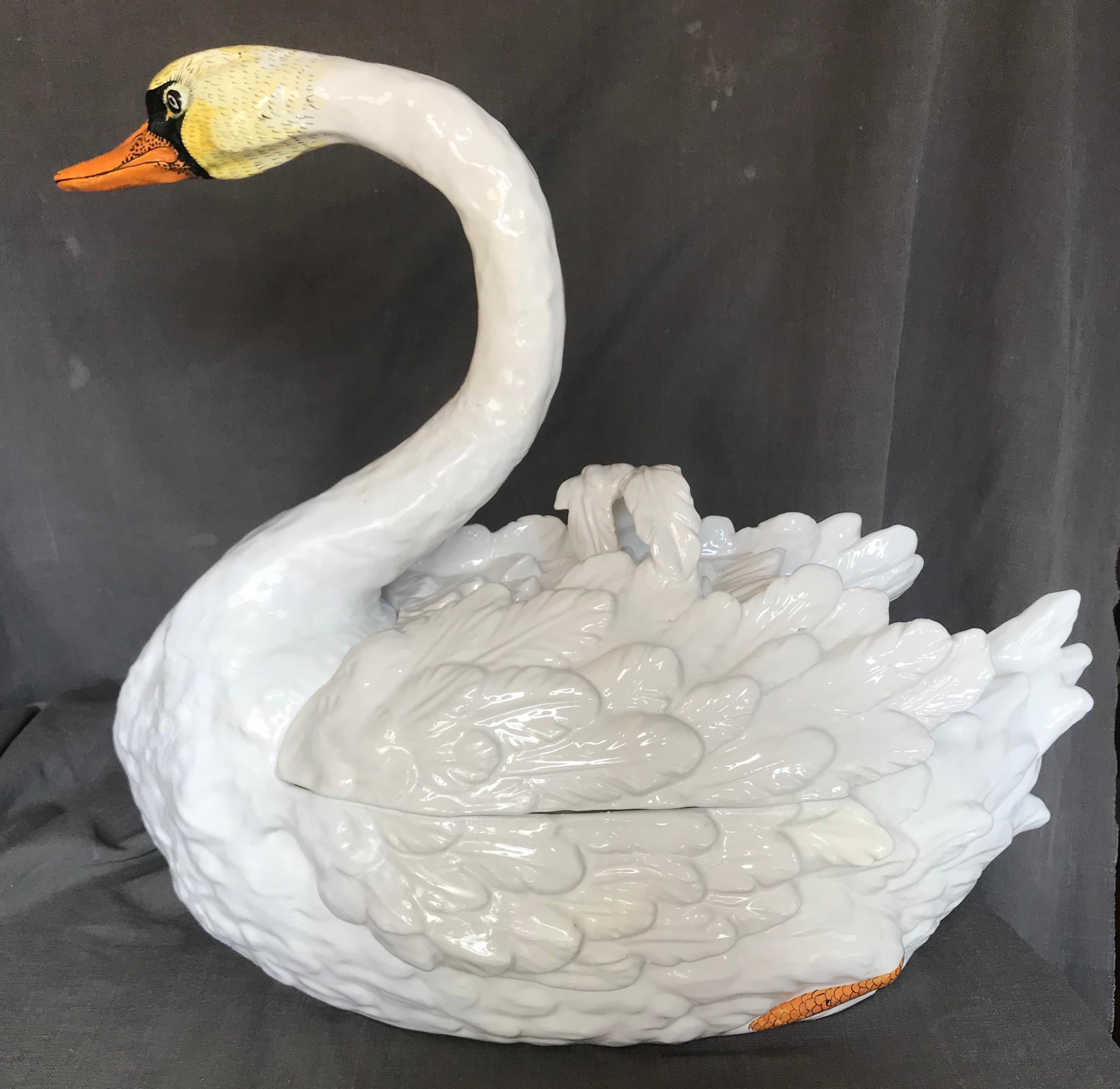 Bassano swan tureen Large decorative ceramic tureen with feather handled lid in the form of a life-size swan; repairs and overpainting. Purely decorative placed in the rafters of a great room or on top of an armoire. Stamped Bassano. Italy, mid-20th