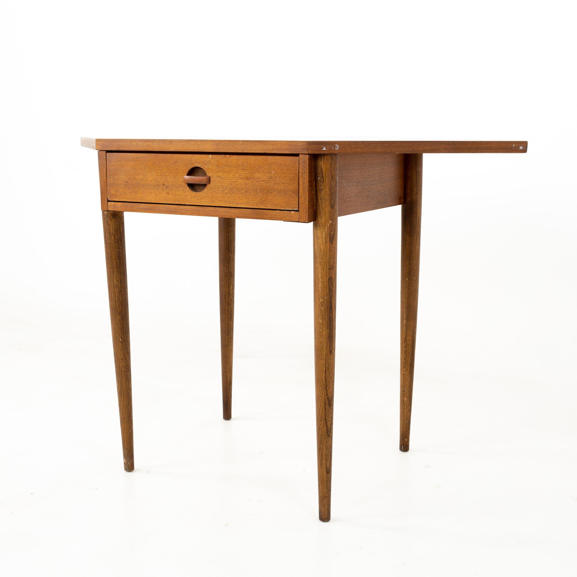 Bassett mid century walnut corner table desk
This desk is 32 wide x 35.5 deep x 30 inches high

All pieces of furniture can be had in what we call restored vintage condition. That means the piece is restored upon purchase so it’s free of