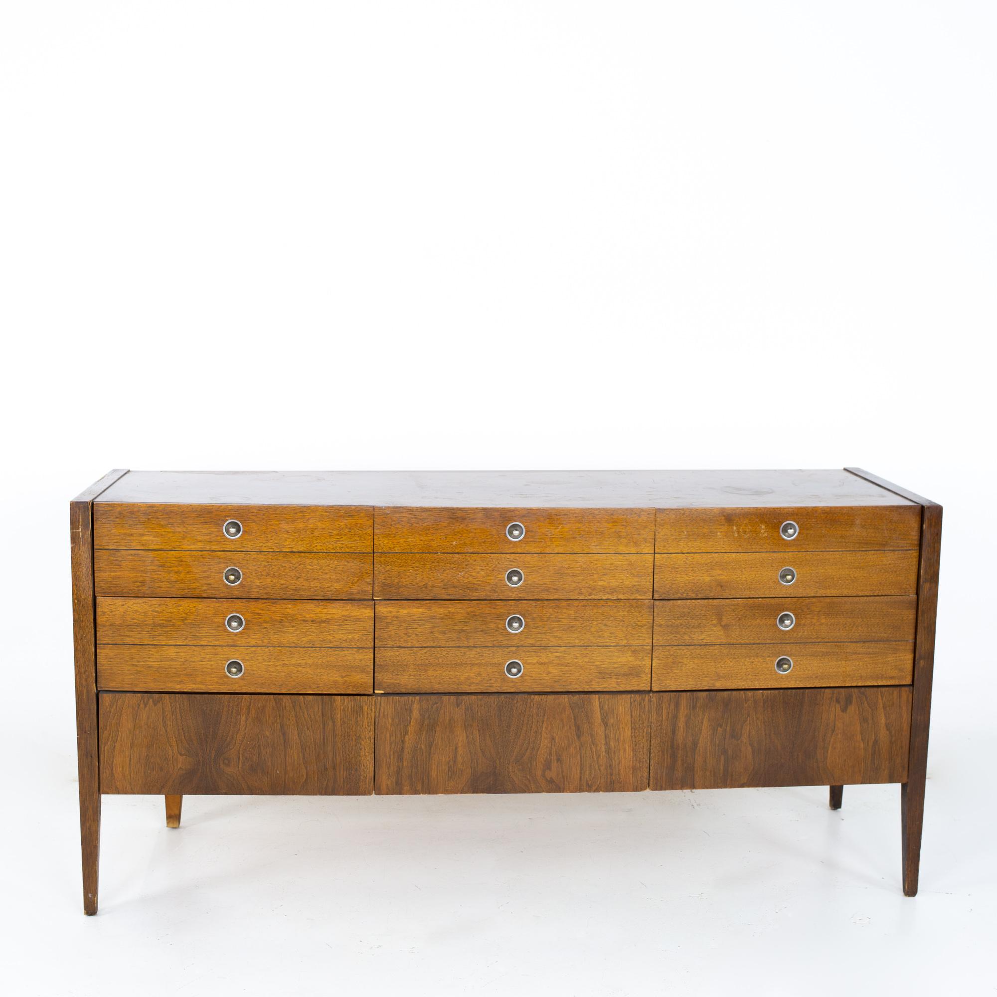 Bassett trimline mid century walnut 9 drawer lowboy dresser
Dresser measures: 60 wide x 19 deep x 30.75 inches high

All pieces of furniture can be had in what we call restored vintage condition. That means the piece is restored upon purchase so