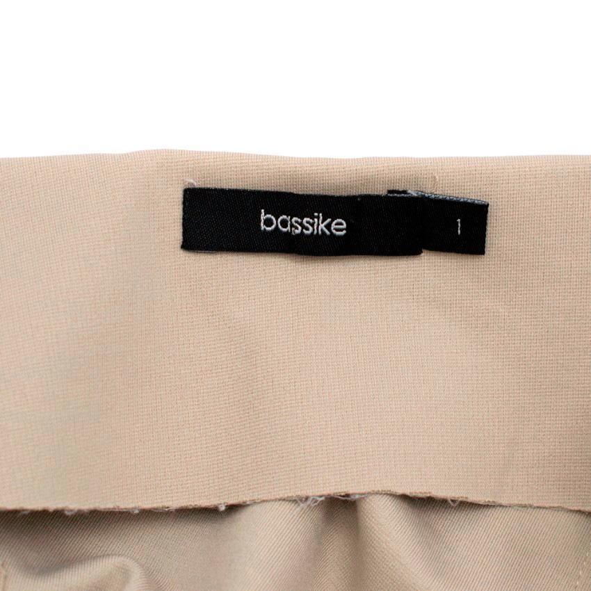 Bassike Taupe Asymmetric Skirt W/ Contrast Stitch Detail

- taupe cotton blend skirt
- a line silhouette, gathering to the side
- medium length
- zip fastening to the side
- single slip pocket to the side
- black stitching embellished

Please note,
