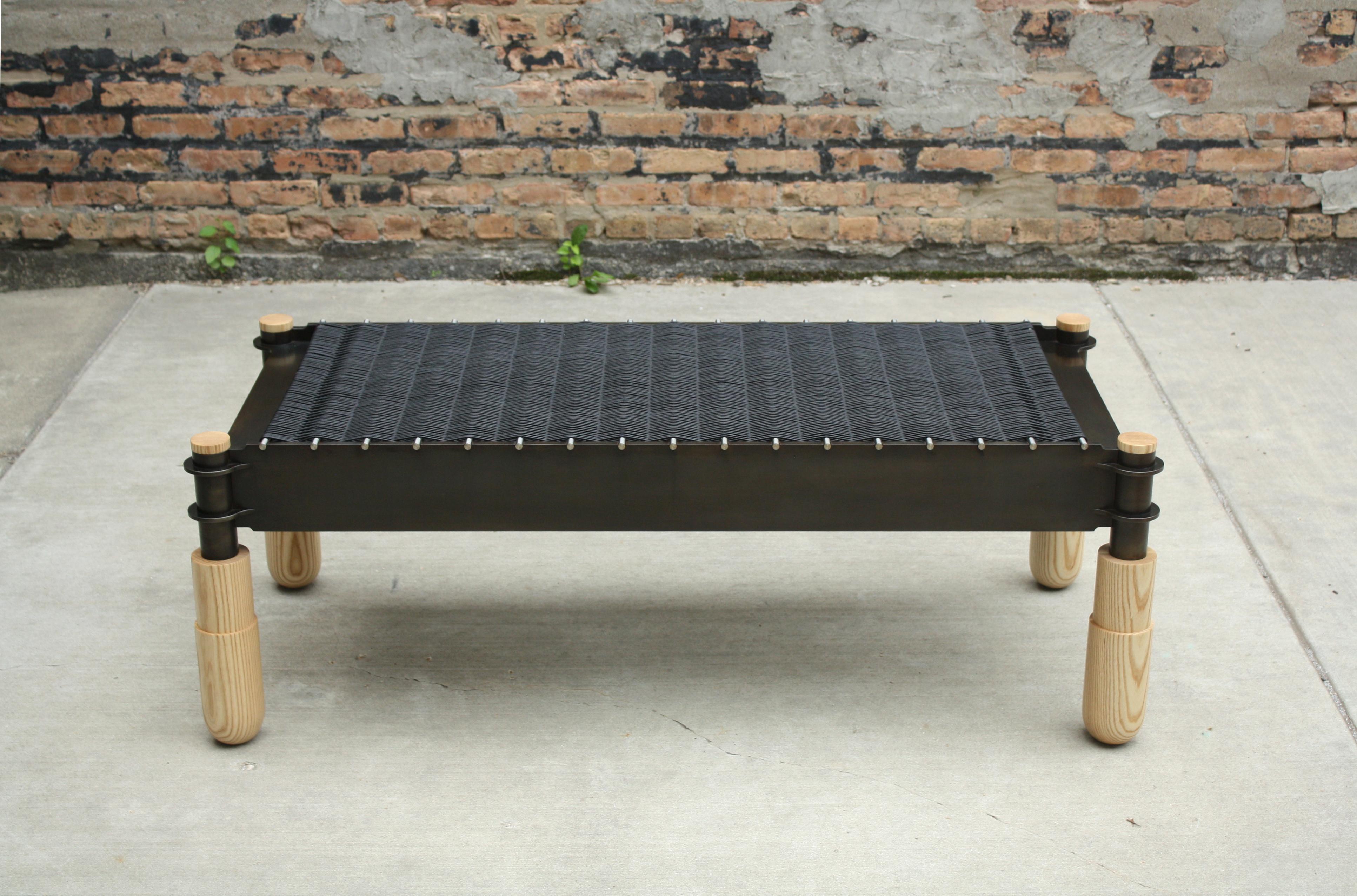 Basso Bench by Laylo Studio
Dimensions: D 53.3 x W 152.4 x H 45.7 cm.
Materials: Blackened steel, stainless steel, leather, ash.

Studio specific interlocking metal joinery and hand-turned, wood legs work together to establish a solid platform