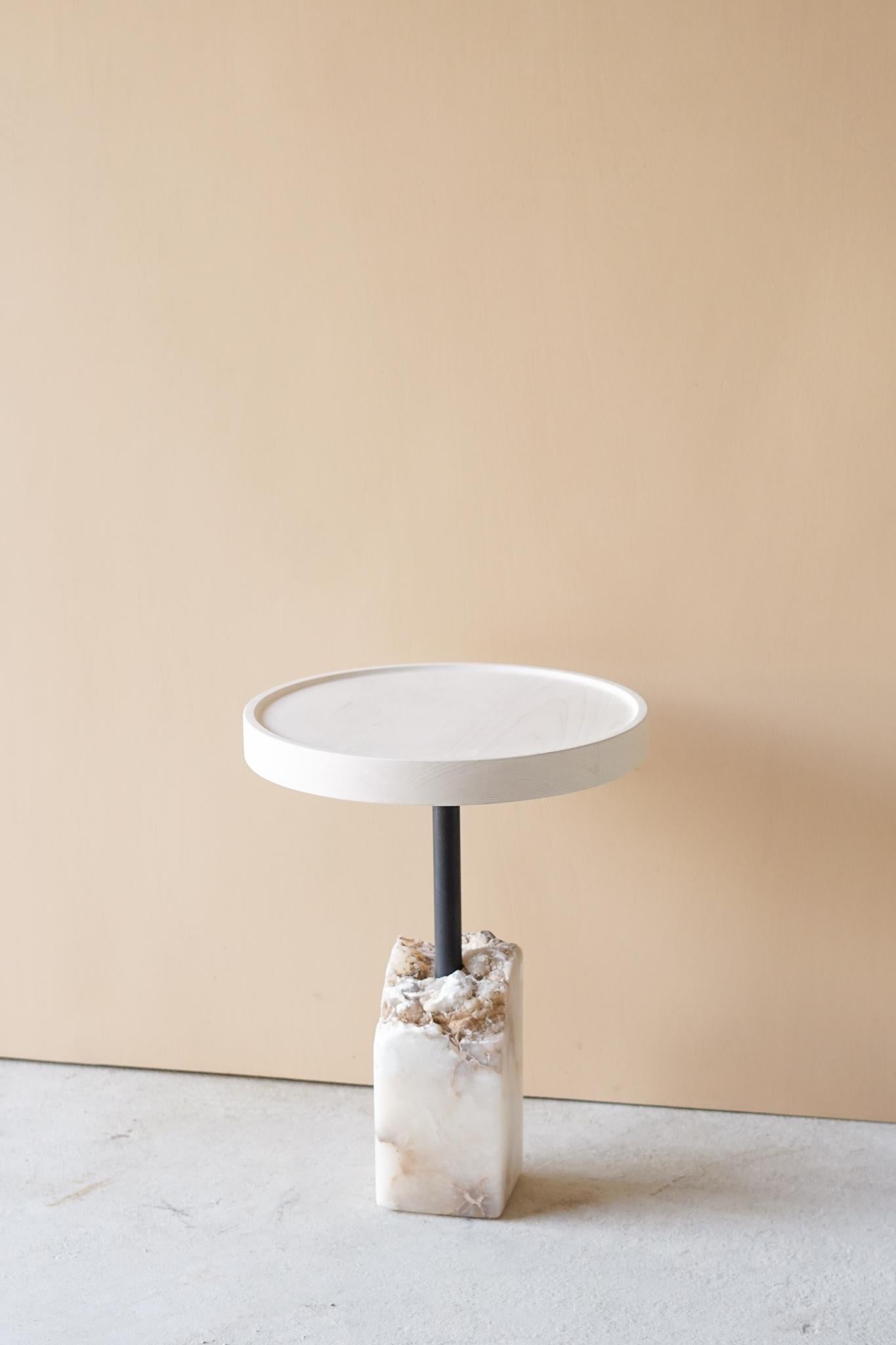 Bast side table by Swell Studio
Dimensions: D46 x W46 x H59 cm.
Material: bleached maple, white alabaster, blackened steel.

Bleached maple top floating above a fragmented piece of stone.

Swell Studio focuses on the design and fabrication of