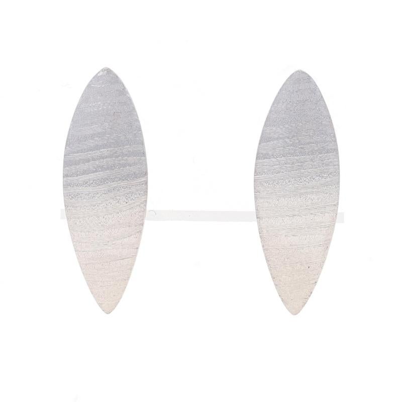 Brand: Bastian Inverun

Metal Content: Sterling Silver

Style: Short Curved Drop
Fastening Type: Butterfly Closures
Theme: Striped Leaf
Features: Smooth & Matte Finishes with Etched Detailing

Measurements
Tall: 13/16