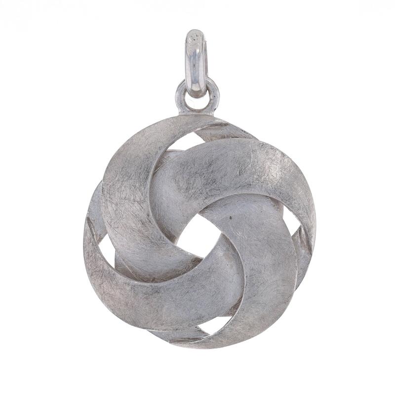 Brand: Bastian Inverun

Metal Content: Sterling Silver

Theme: Woven Knot, Circle
Features: Brushed Finish

Measurements
Tall (from stationary bail): 1 1/32