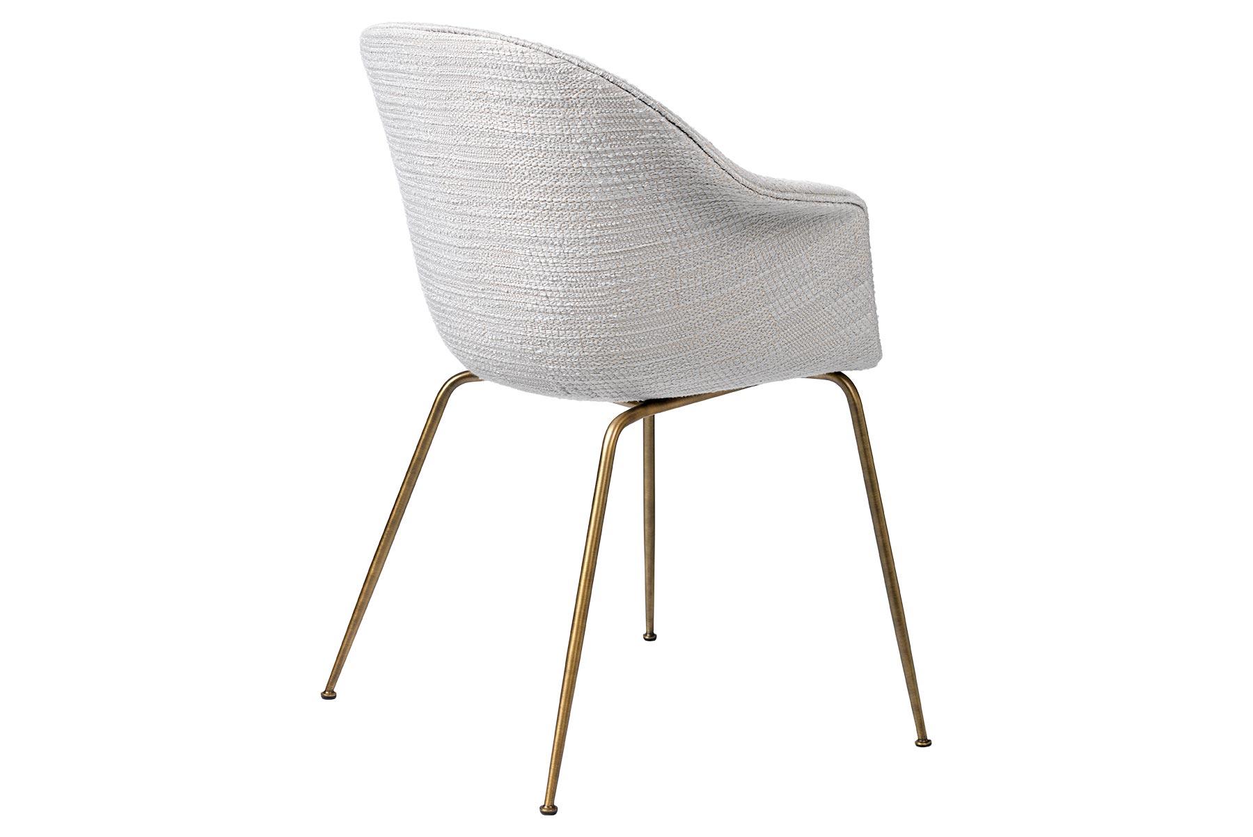The bat dining chair is created with a Scandinavian approach to crafts, simplicity and functionalism by Danish-Italian design-duo GamFratesi. The embracing shell with armrests equally embodies both aesthetics and comfort while carrying strong