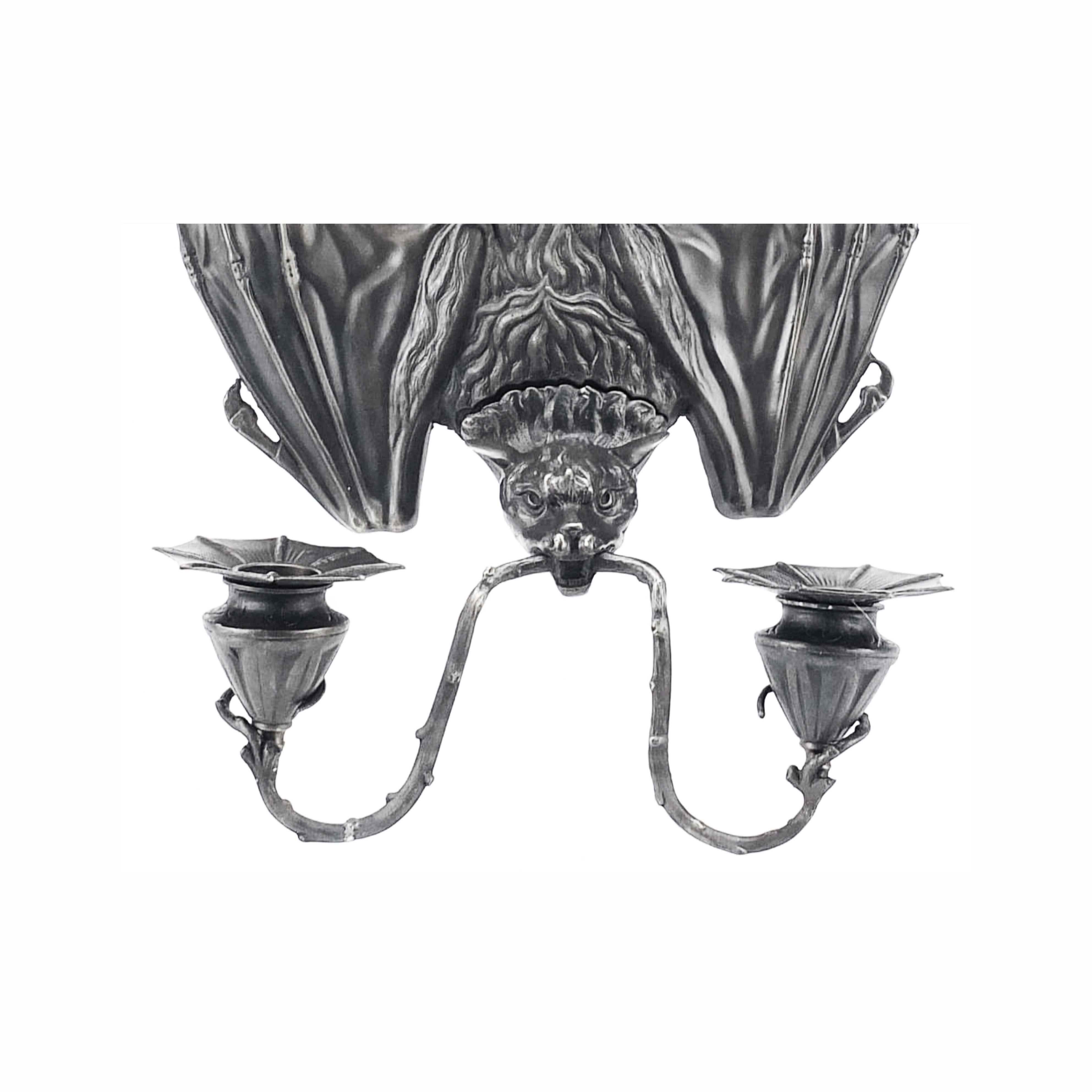 Silverplate wall light in the shape of a bat with two supports for candles. The bat was a very popular animal during the late 19th century and really inspired all Art Nouveau designers, most specifically some jewel designers such as Lalique who