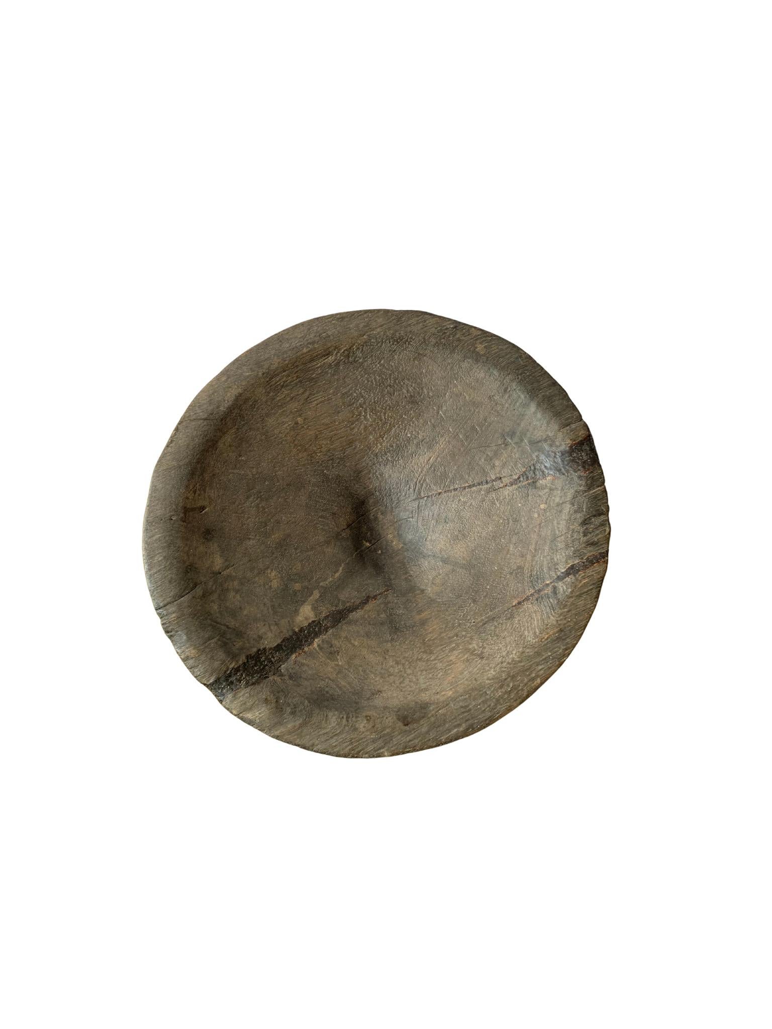 Batak tribe ceremonial bowl from jackfruit wood, early 20th century. The Batak Tribes are ethnic groups predominantly found in North Sumatra, Indonesia. The bowl features a wonderful age related patina and mix of wood textures. 

