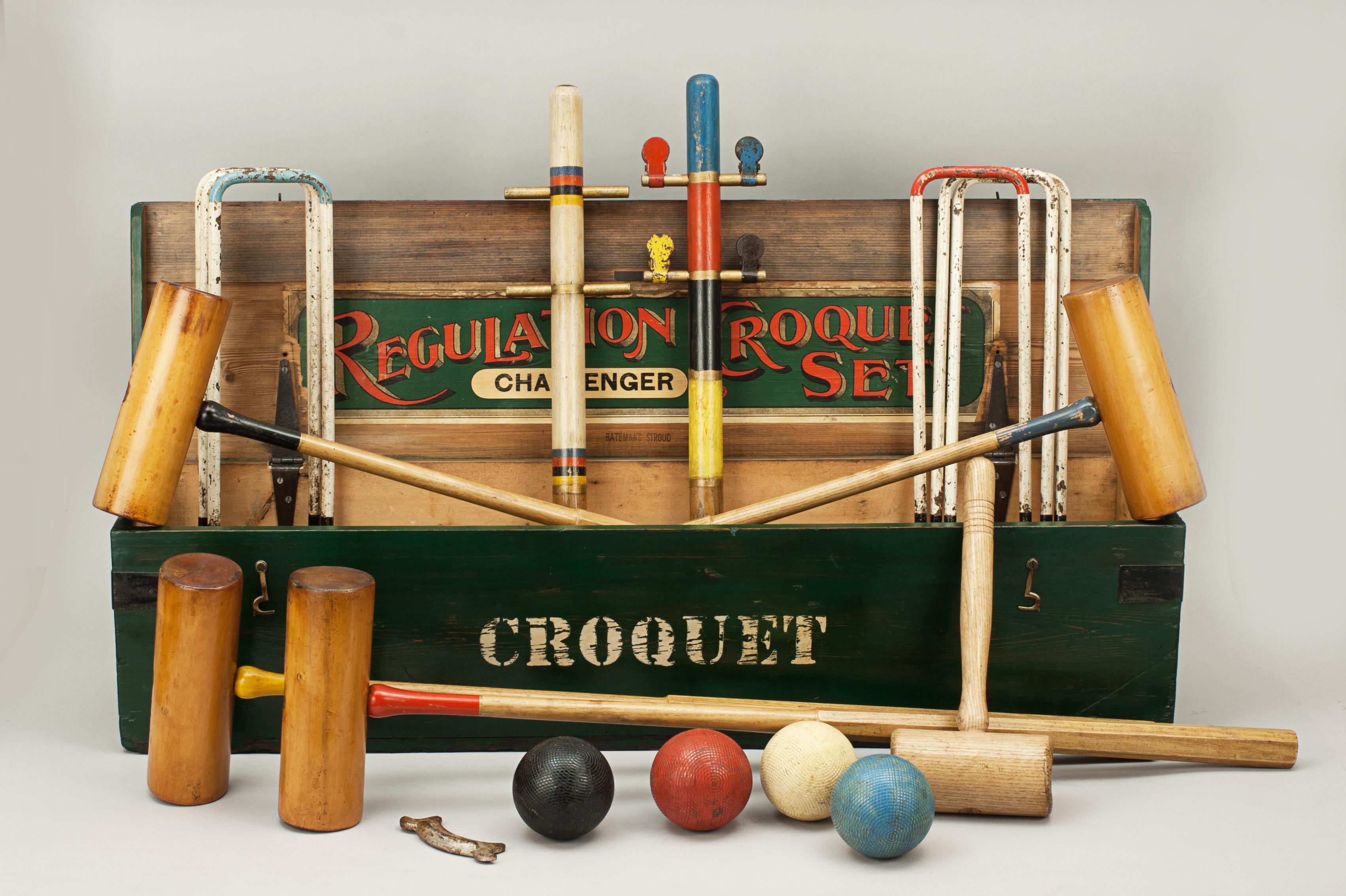 Boxed Bateman four mallet garden croquet set.
A four mallet garden croquet set in a painted pine storage box with metal carry handles at either end. The set comprises of four boxwood mallets with ebony stringing alinement lines and the faces with