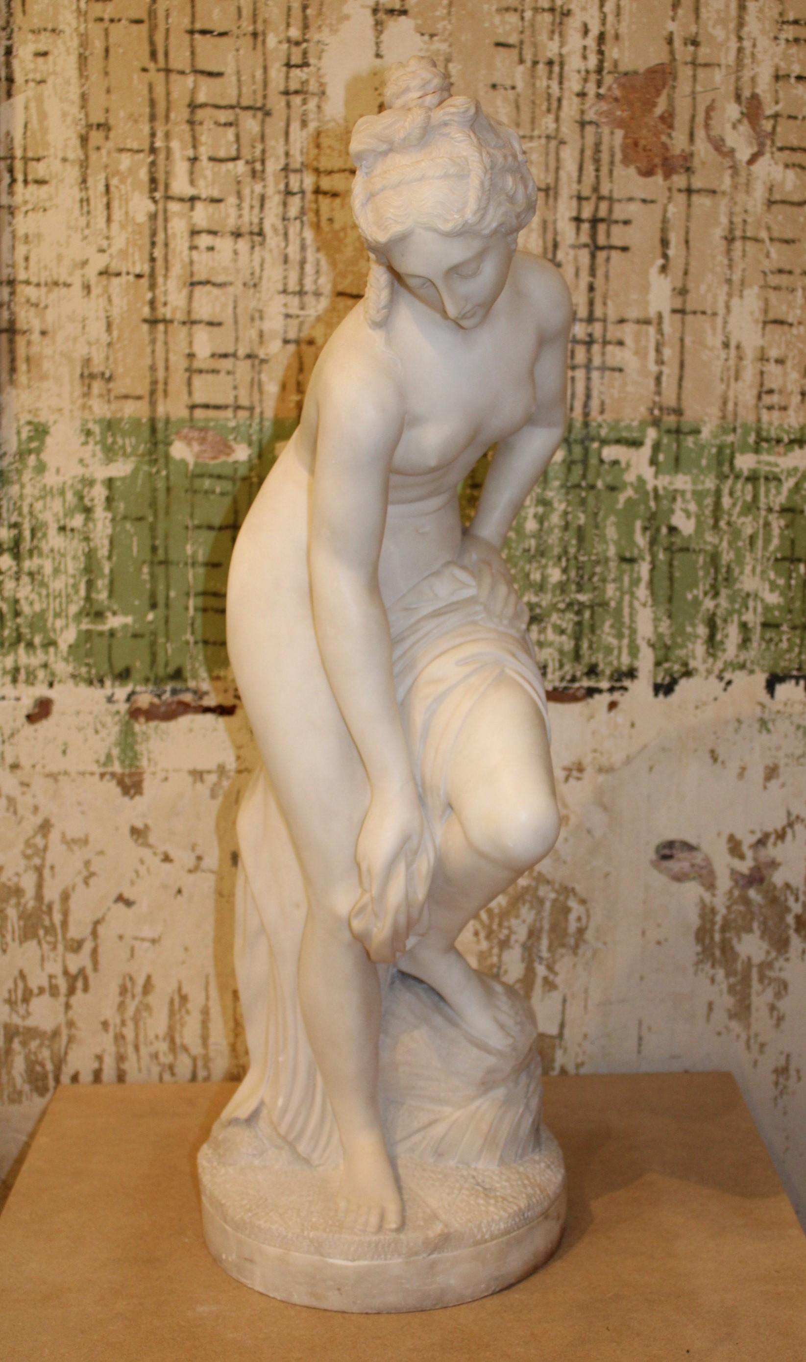 Bather sculpture in white carrara marble.