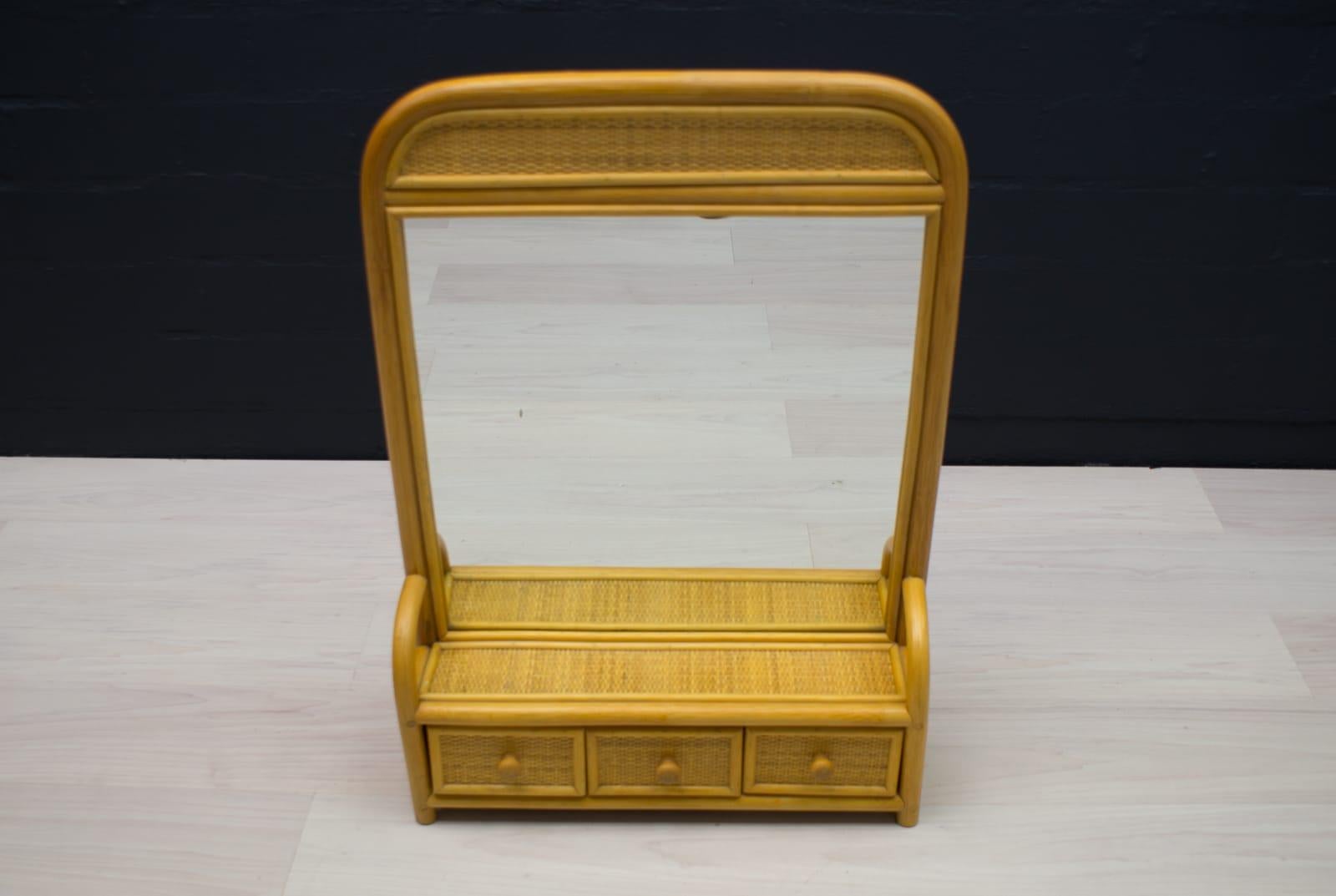 Bathroom bamboo and rattan wall mirror with three drawers, 1960s Italy

To hang or place on the wall. 