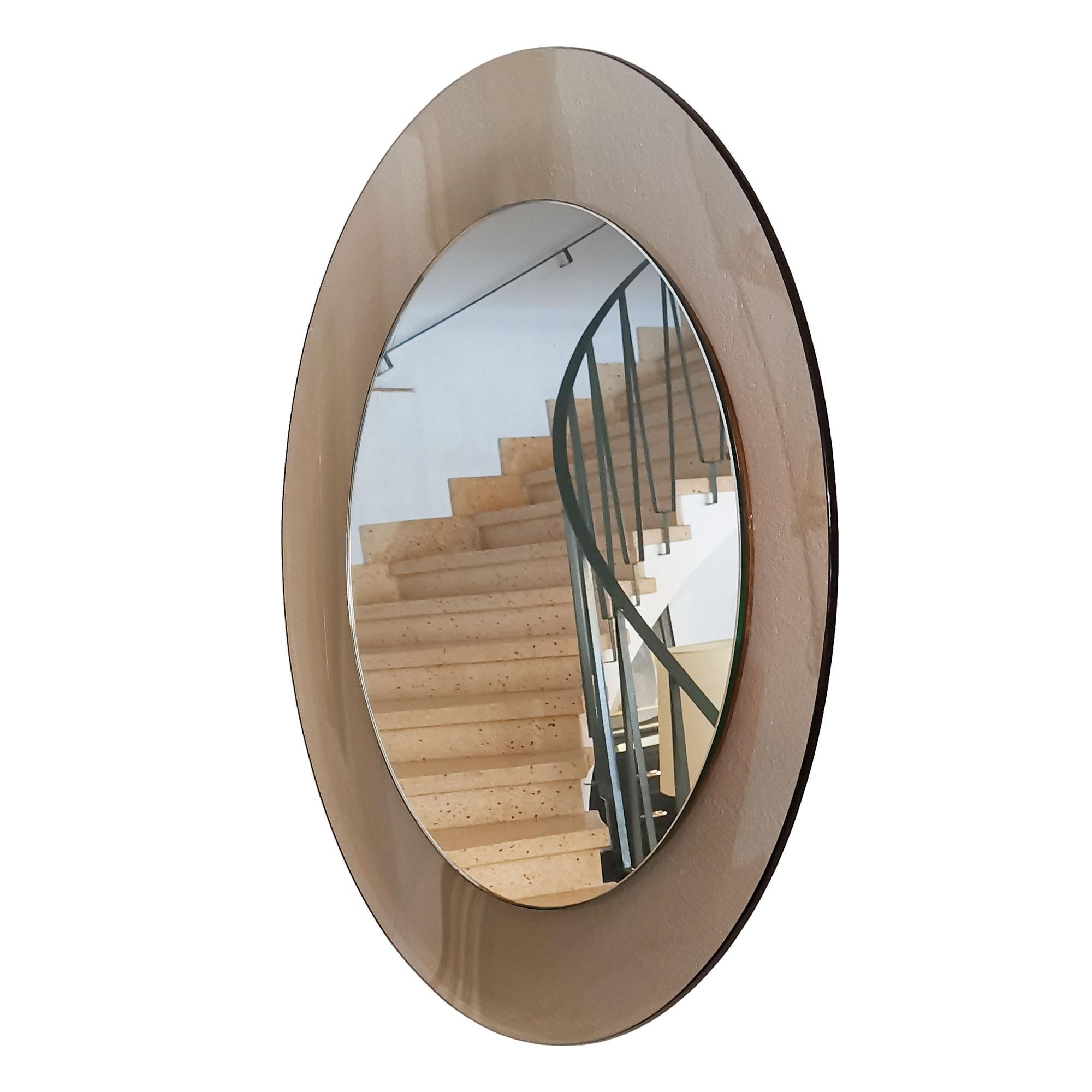 Large round bathroom mirror, smoked gray curved glass frame.

Italy c. 1960.