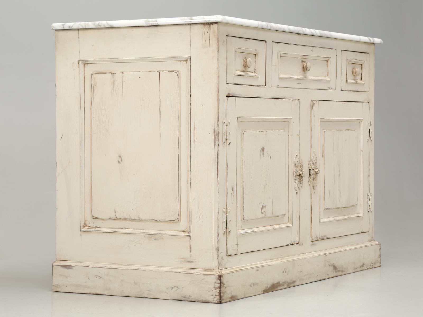 Custom fabricated by an experienced master craftsman circa 20-25 years ago and was never installed. Beautiful Calcutta d'Oro polished marble top and a dead panel in the center where the sink is to be located. The faux center drawer is flanked by