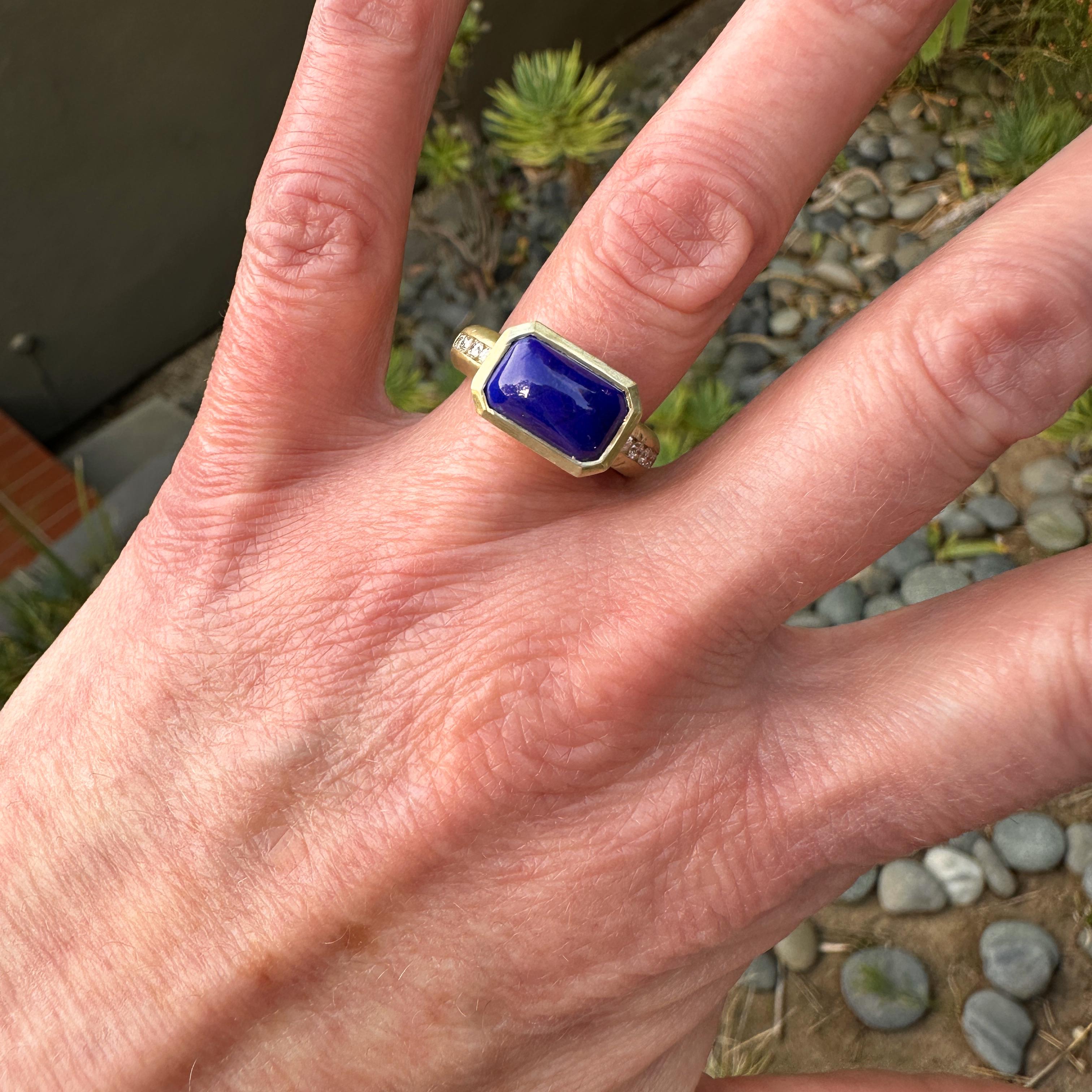 This bold new 18 karat gold ring by Eytan Brandes features a custom-cut lapis in an inverted rectangular bezel.  A recessed channel on each shoulder holds five bright white diamonds.  The shank and the walls of the bezel are both unapologetically