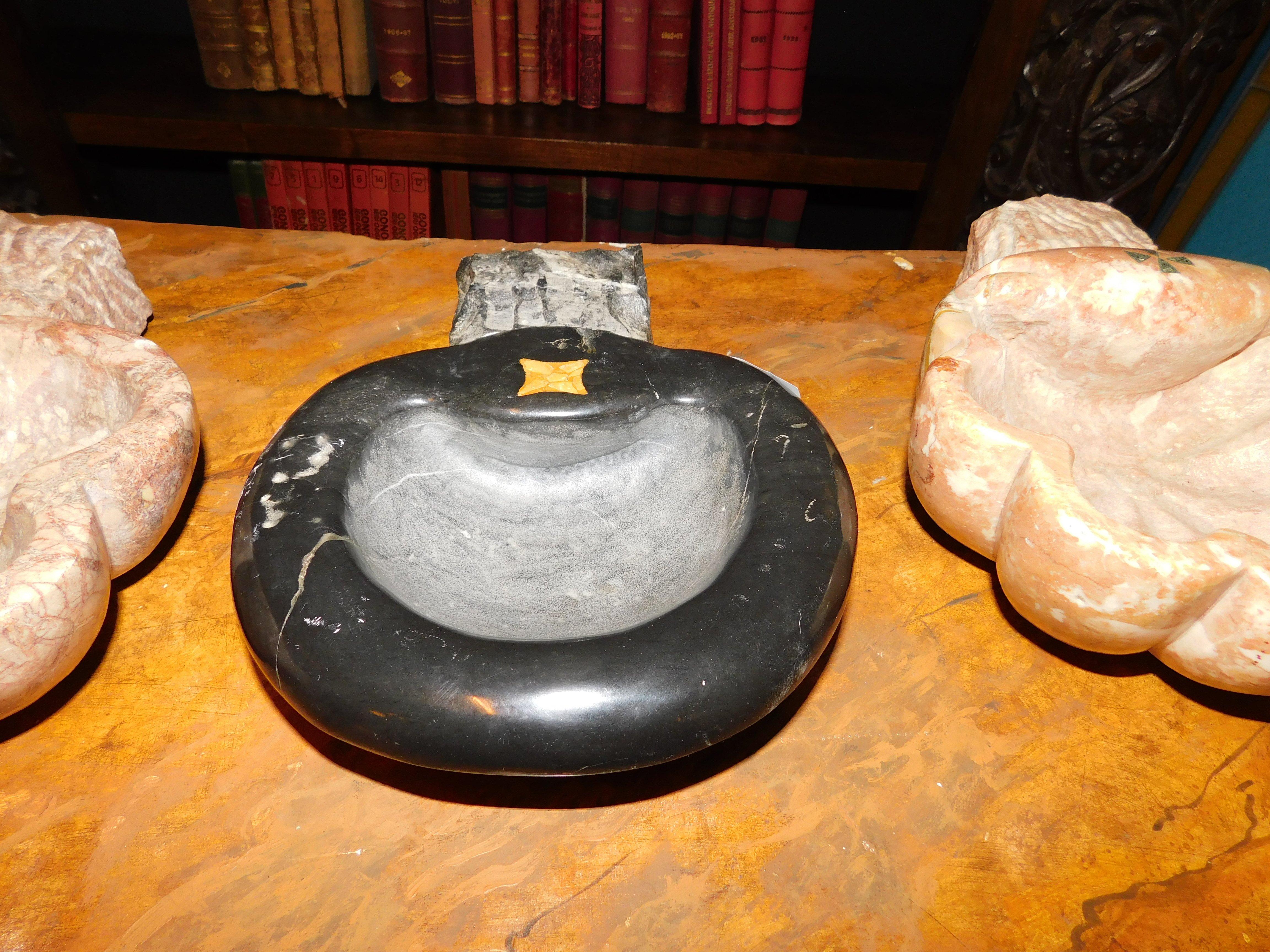 Ancient stoup in black marble with yellow inlay, in the shape of a small basin, built in Italy in the 18th century for a village church, usable as a small tub or sink, both indoors and outdoors, graceful ancient and historical relic of fine marbles,