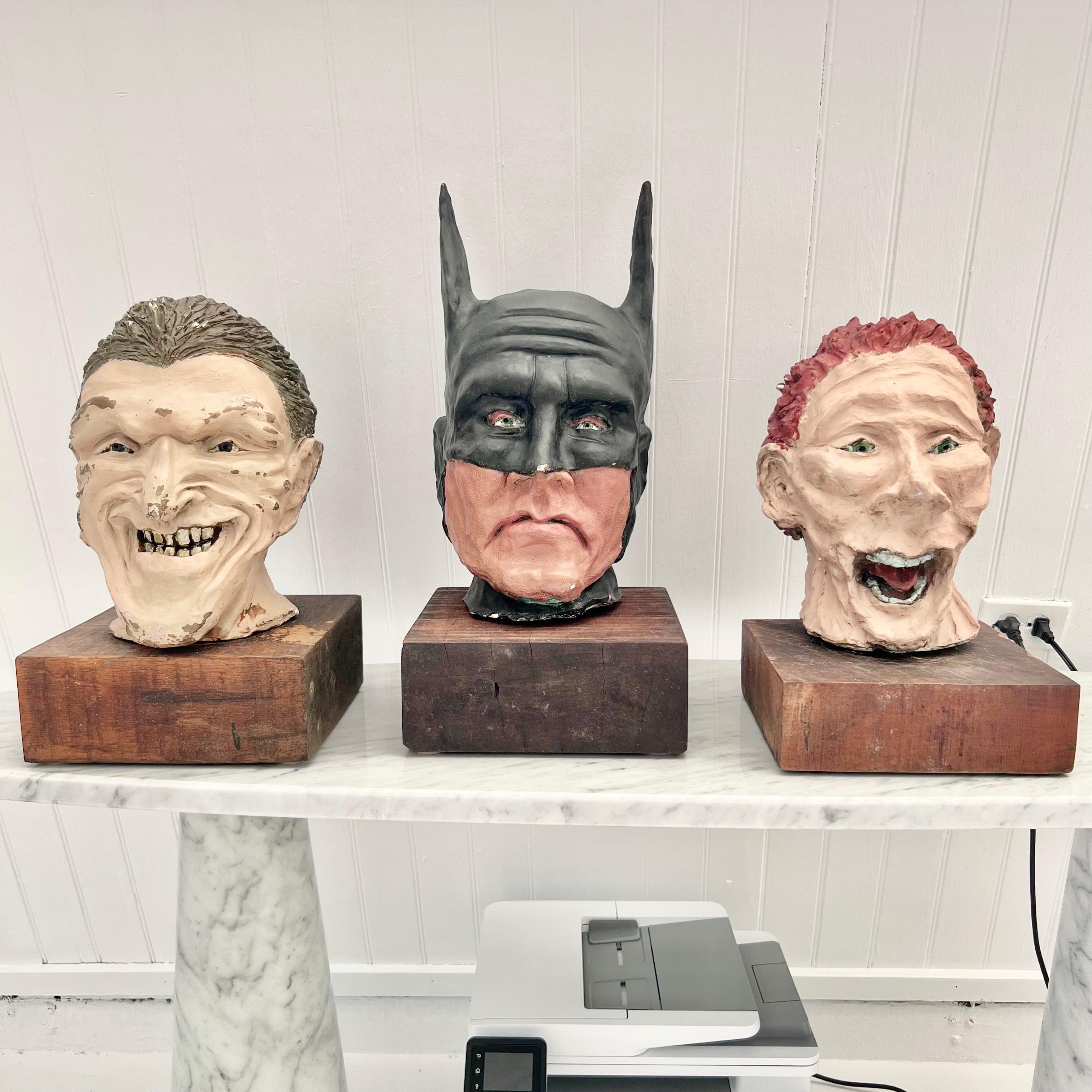 Unique and peculiar painted clay character busts of Batman, Joker and Riddler. Life sized, heavy, and well made. Unknown provenance. All signed 'AG 2004' on the back carved into the clay. Unable to find anything similar online. A wonderfully creepy