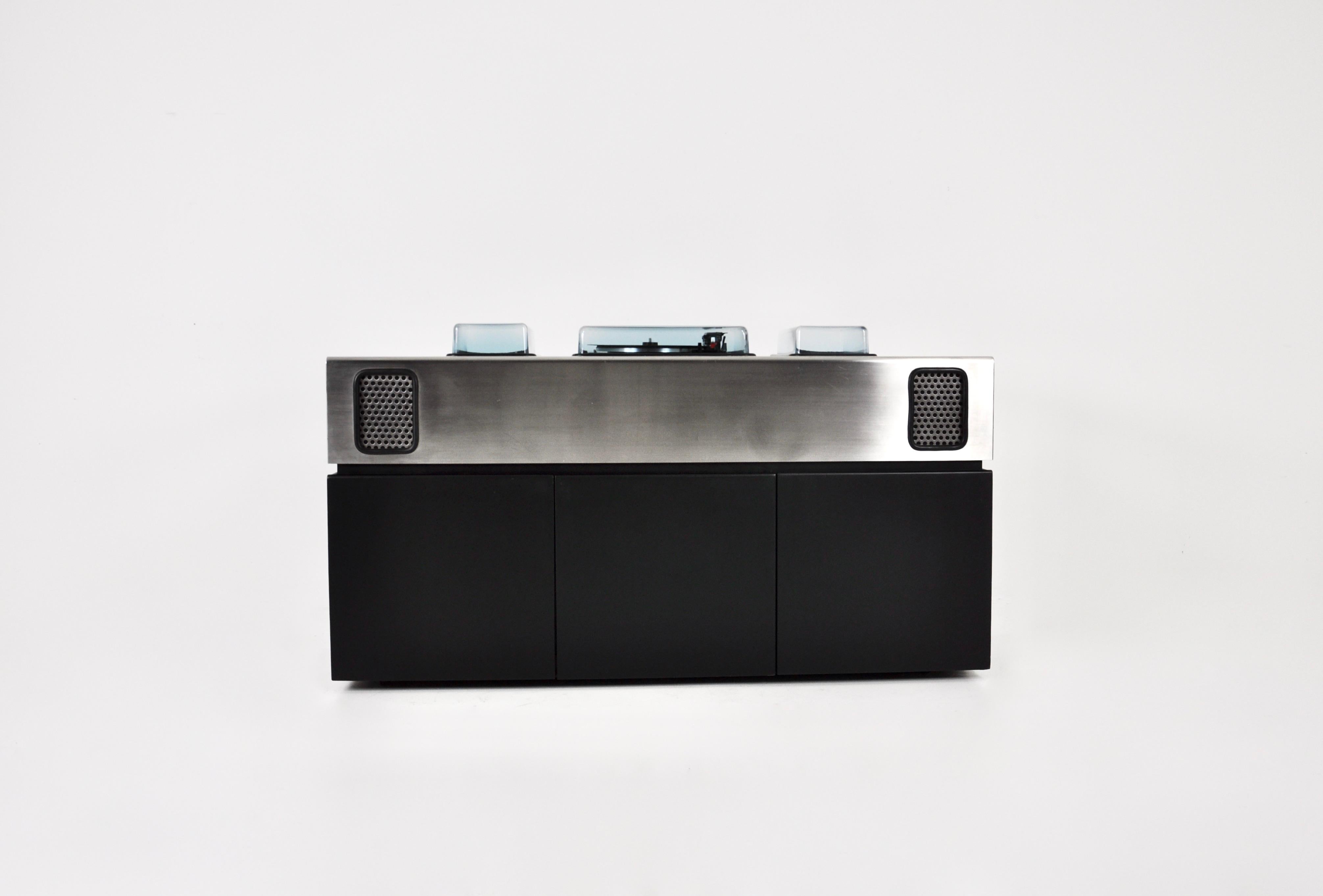 Batman record player, radio and bar by Adalberto dal Lago & Adam Tihany for Giuseppe Rossi. The top is in brushed chrome metal with integrated speakers and the underside in black wood. There are two storage drawers and a fridge in the middle.