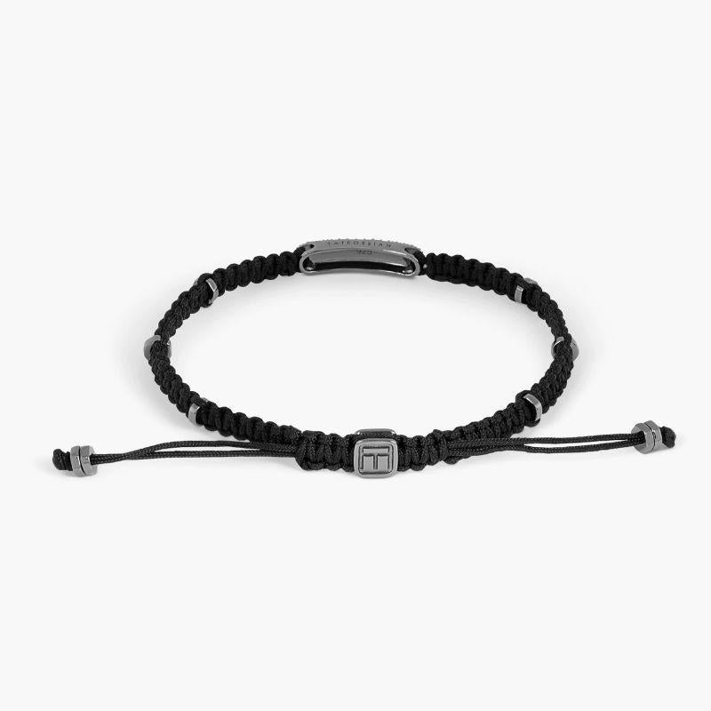 Baton Bracelet with Emerald in Black Macramé and Black Rhodium Plated Sterling Silver, Size L

58 pave set emeralds sit within our black rhodium-plated, sterling silver frame with black silver disc elements added around the bracelet, to give little