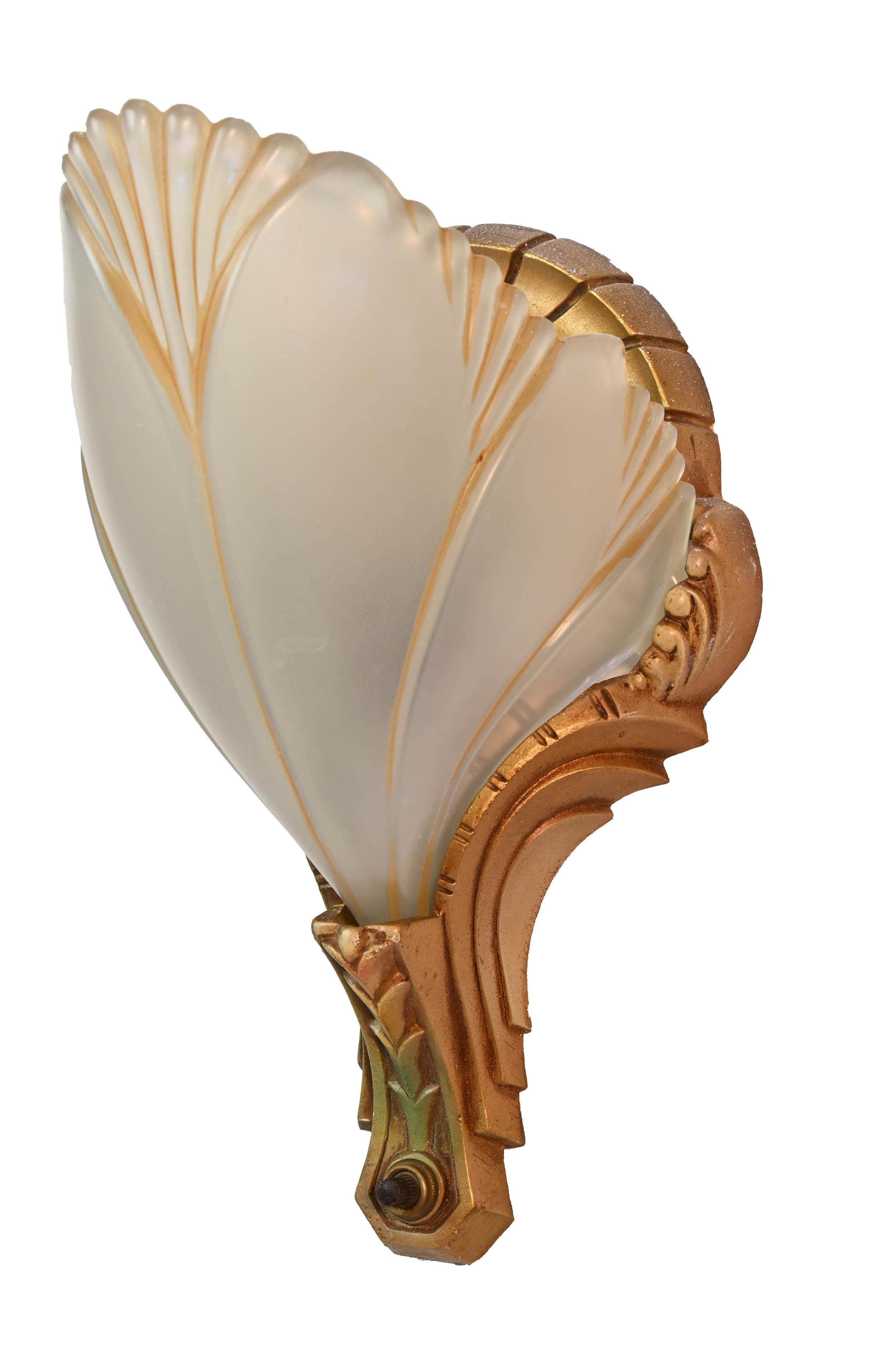 Beautiful gold painted cast aluminum fixtures by Markel. These batwings are elegantly lined in gold with pastel polychrome accents. 

Illumination: 1 standard Edison sockets
Dimensions: 9” height x 5 1/2” wide & 6” projection 

We find that