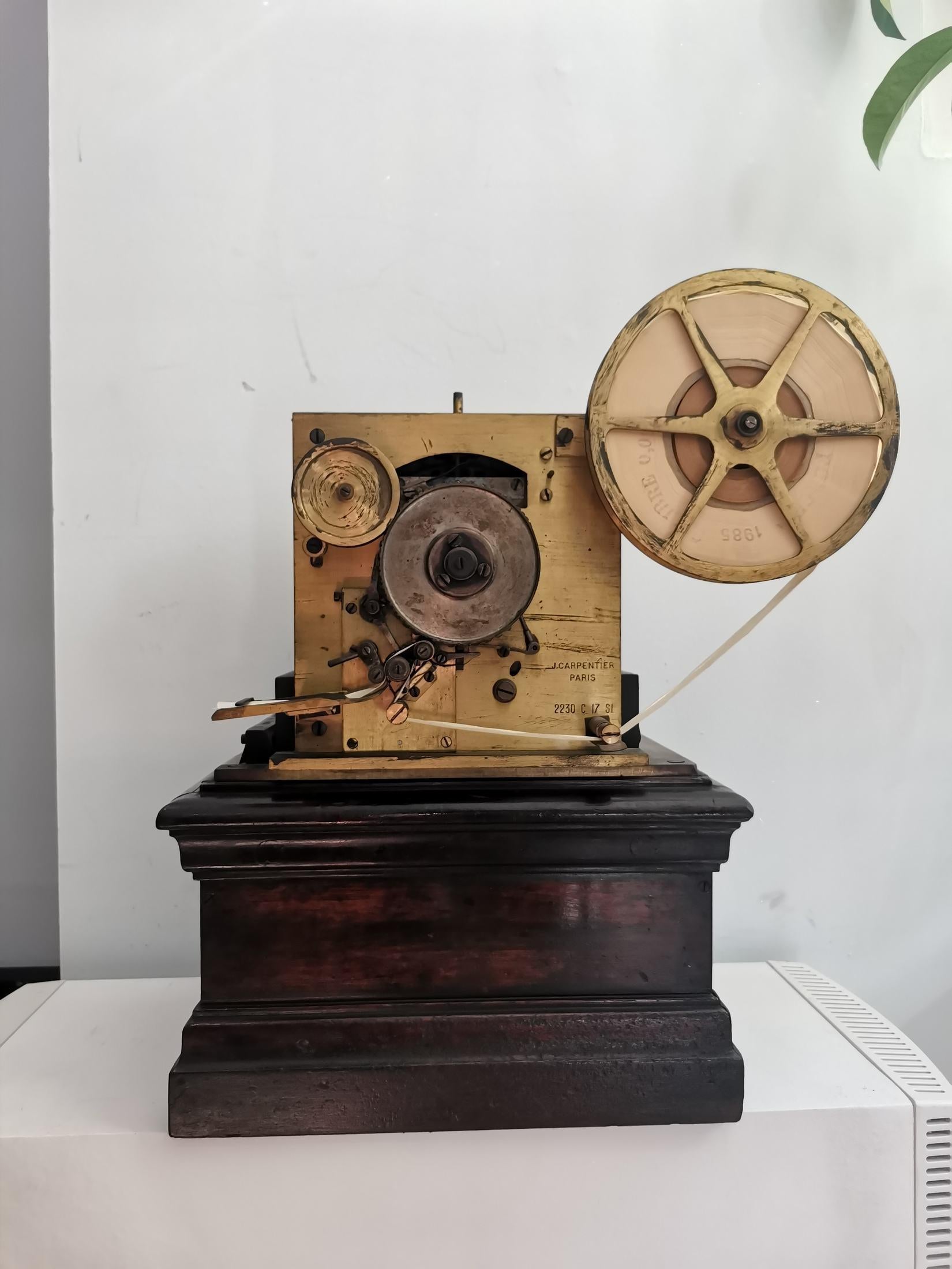 Baudot multiple-impression telegraph, c. 1900 Manufactured by J Carpentier Paris, 
brass and steel, Grunewald type electric motor mounted upside down. 
For the five-bit Baudot code. 
With constantly rotating print wheel and five internal relays