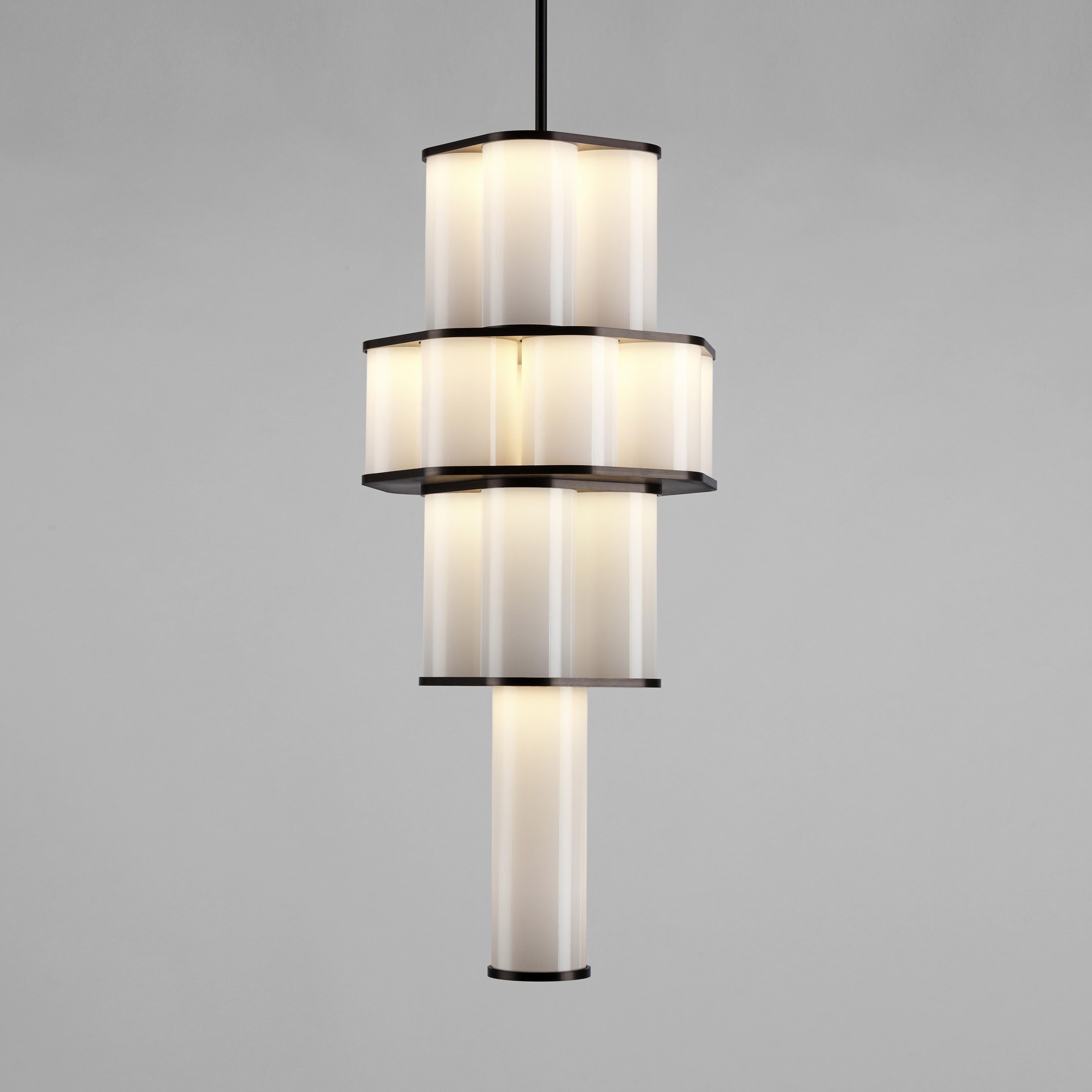 Jason Miller’s Bauer is a pendant fixture made of stacked, concentric clusters of handblown tubular glass. The glass fades from dark to light, recalling the tonalities of earth-to-sky views, producing an ethereal, atmospheric effect.

Please note