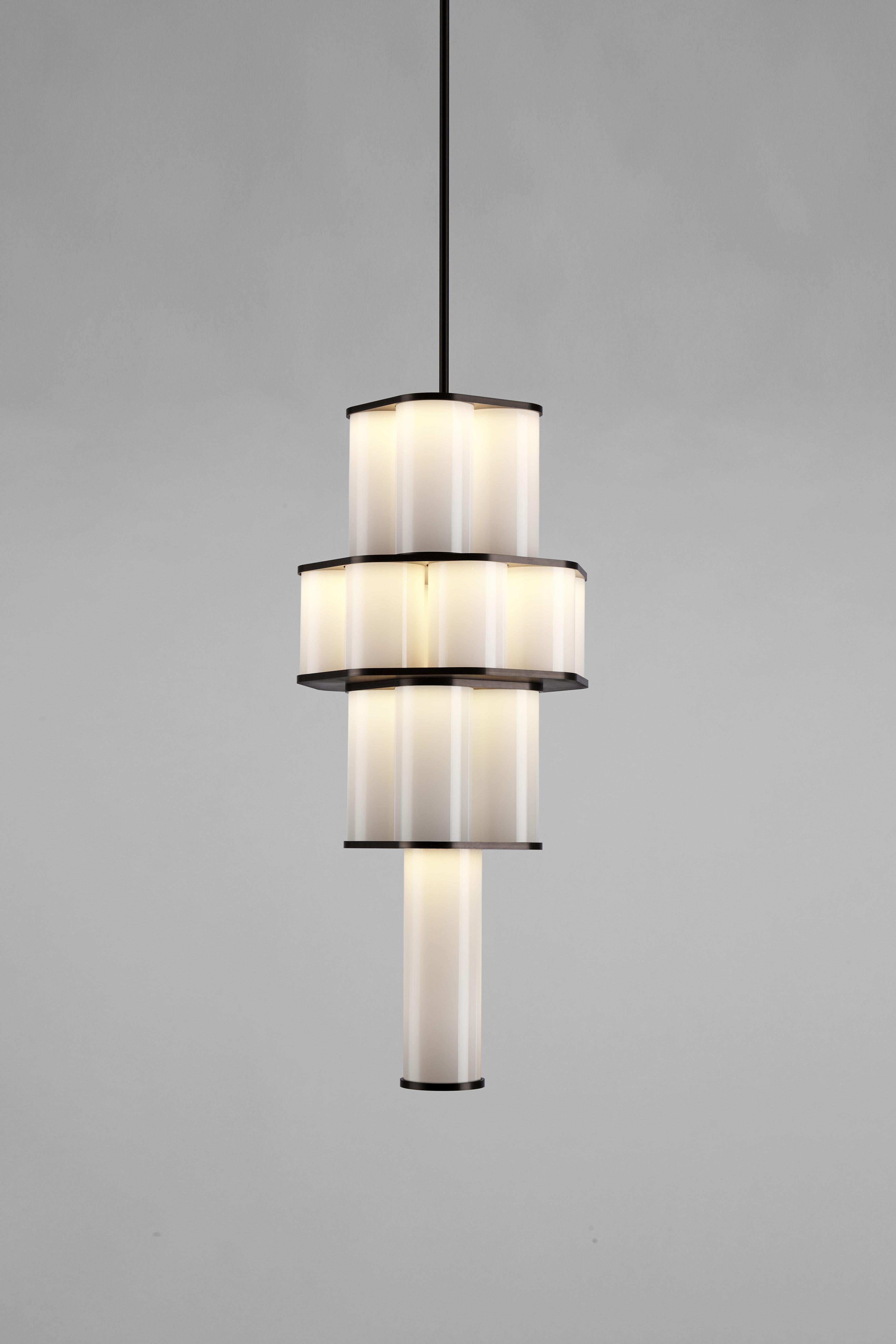 Jason Miller’s Bauer is a pendant fixture made of stacked, concentric clusters of hand blown tubular glass. The glass fades from dark to light, recalling the tonalities of earth-to-sky views, producing an ethereal, atmospheric effect.

Please note