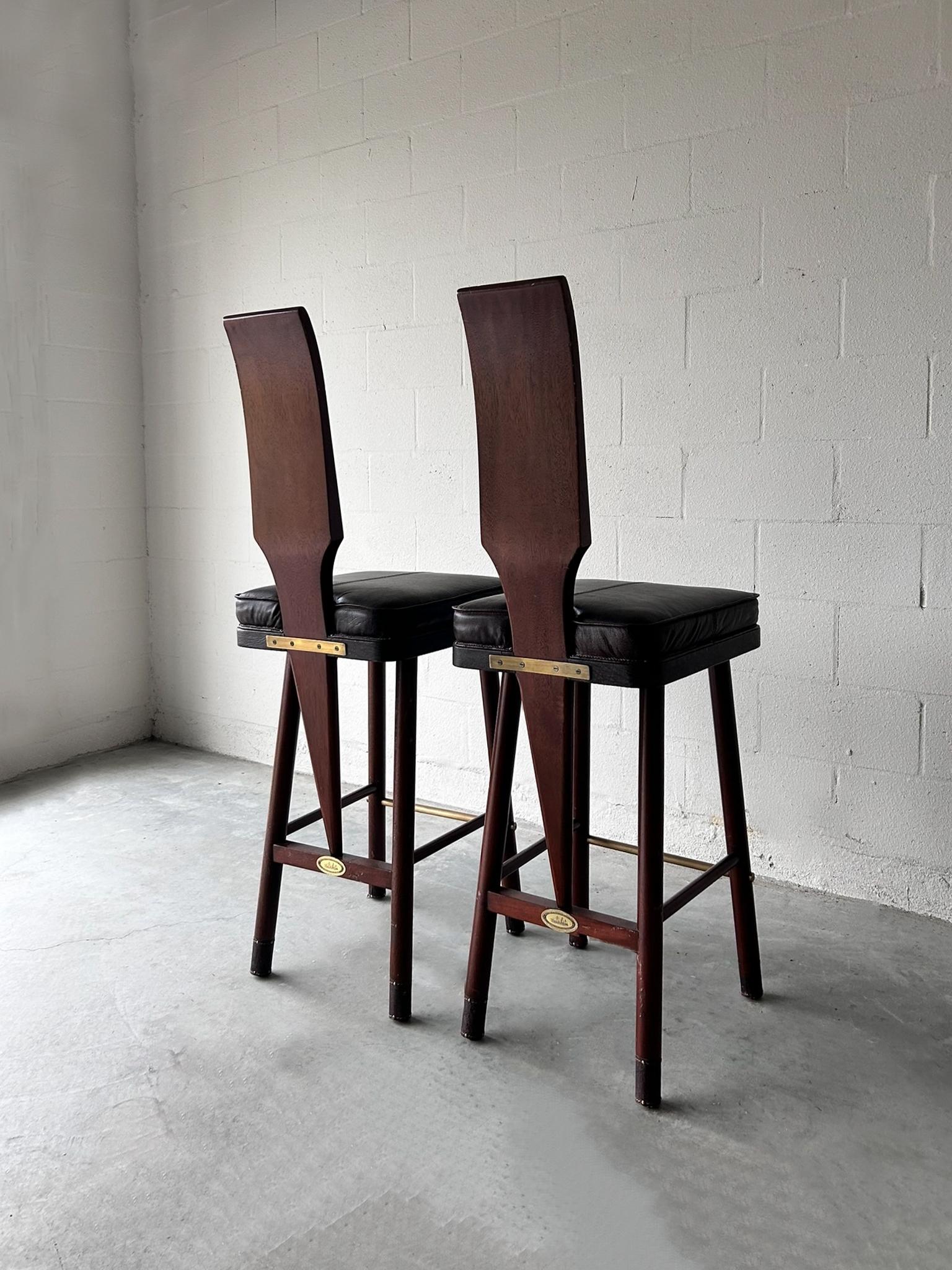 A set of Bauer International campaign style barstools. Seat and leg accents crafted from genuine leather. Part of the Schooner Collection.

DIMENSION::

Overall
 :- 55.5