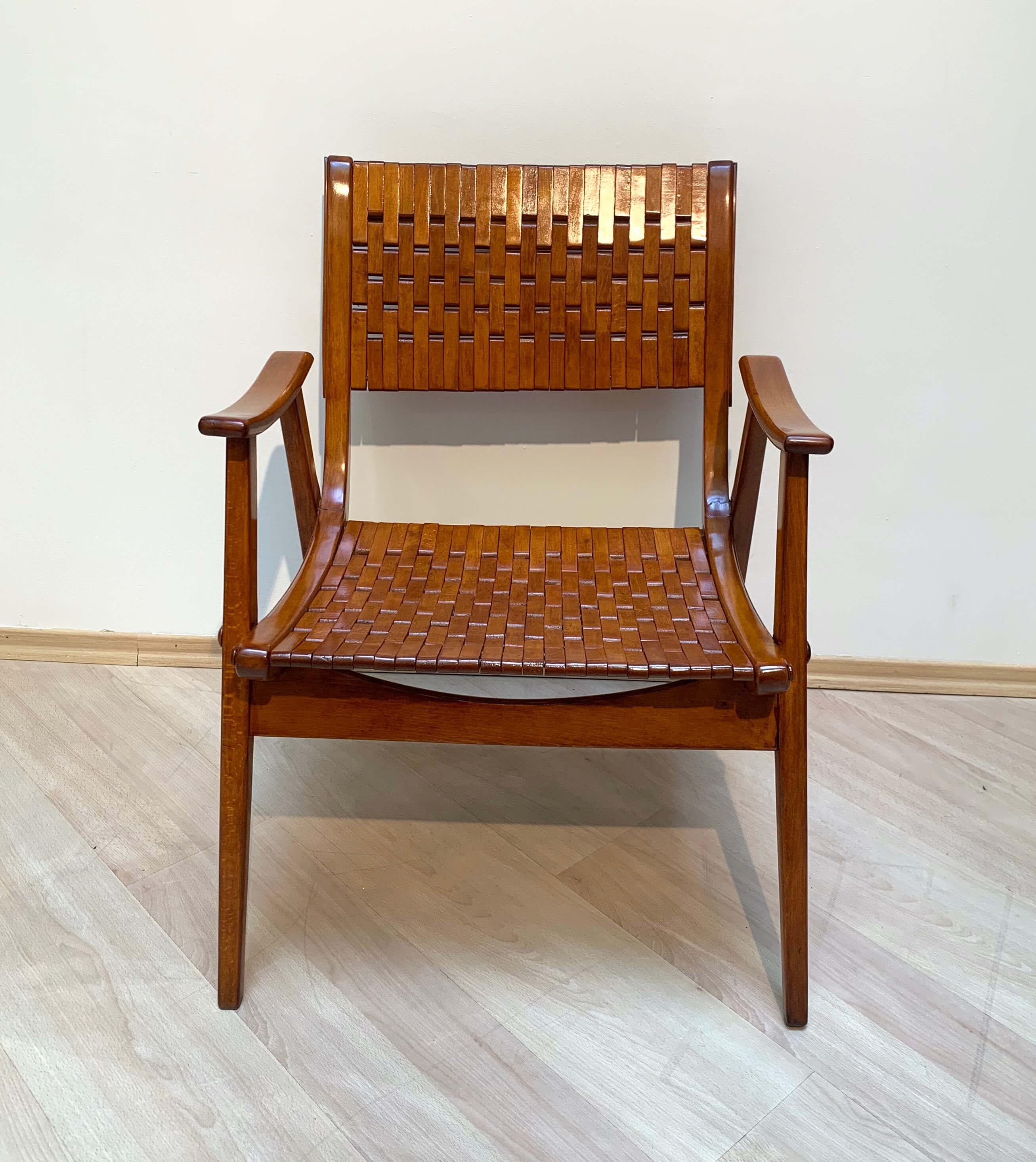 Beautiful, Bauhaus armchair by Erich Diekmann for Gelenka from Germany circa 1930-50s.

Executed in bent beech plywood and a webbed back. The chair has been restored and lacquered with shellac. Designed by the German designer Erich Dieckmann for