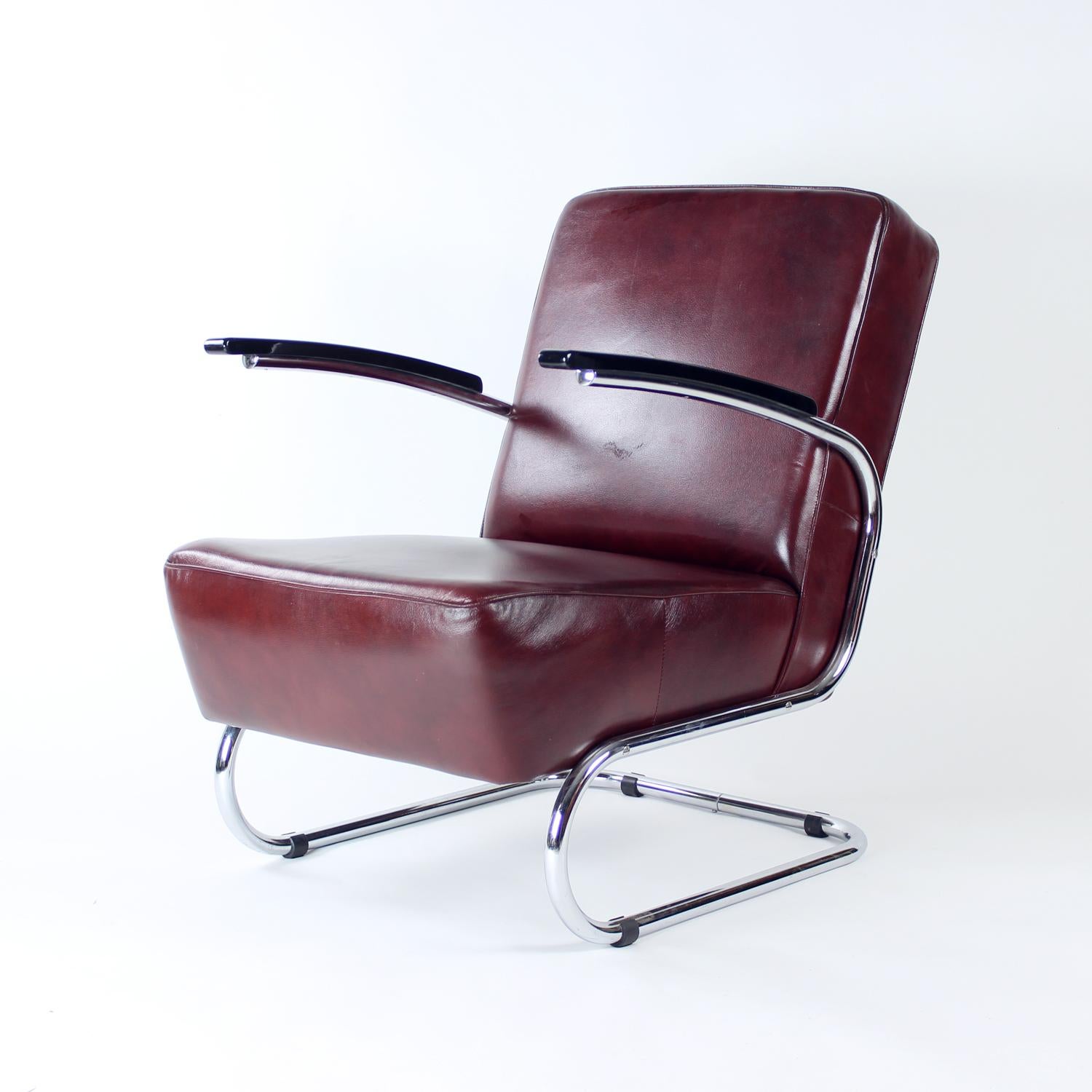 Unique armchair produced in the Bauhaus era, completely restored for the 21st century. the armchair was created in Czechoslovakia. The construction is made of bent chrome steel pipes and create a very comfortable, almost spring like seating. The