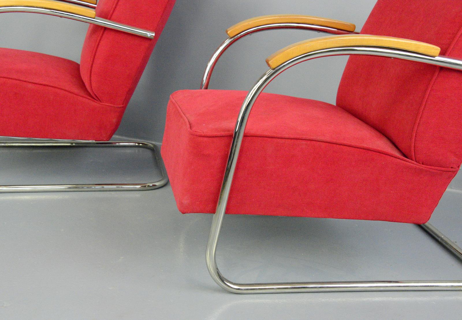 Bauhaus armchairs by Mucke Melder, circa 1930s.

- Price is for the pair
- Sprung seats and back rest
- Chrome-plated tubular steel cantilever frames
- New red velvet upholstery
- Model FN21
- Produced by Mucke Melder
- Czech, 1930s
-
