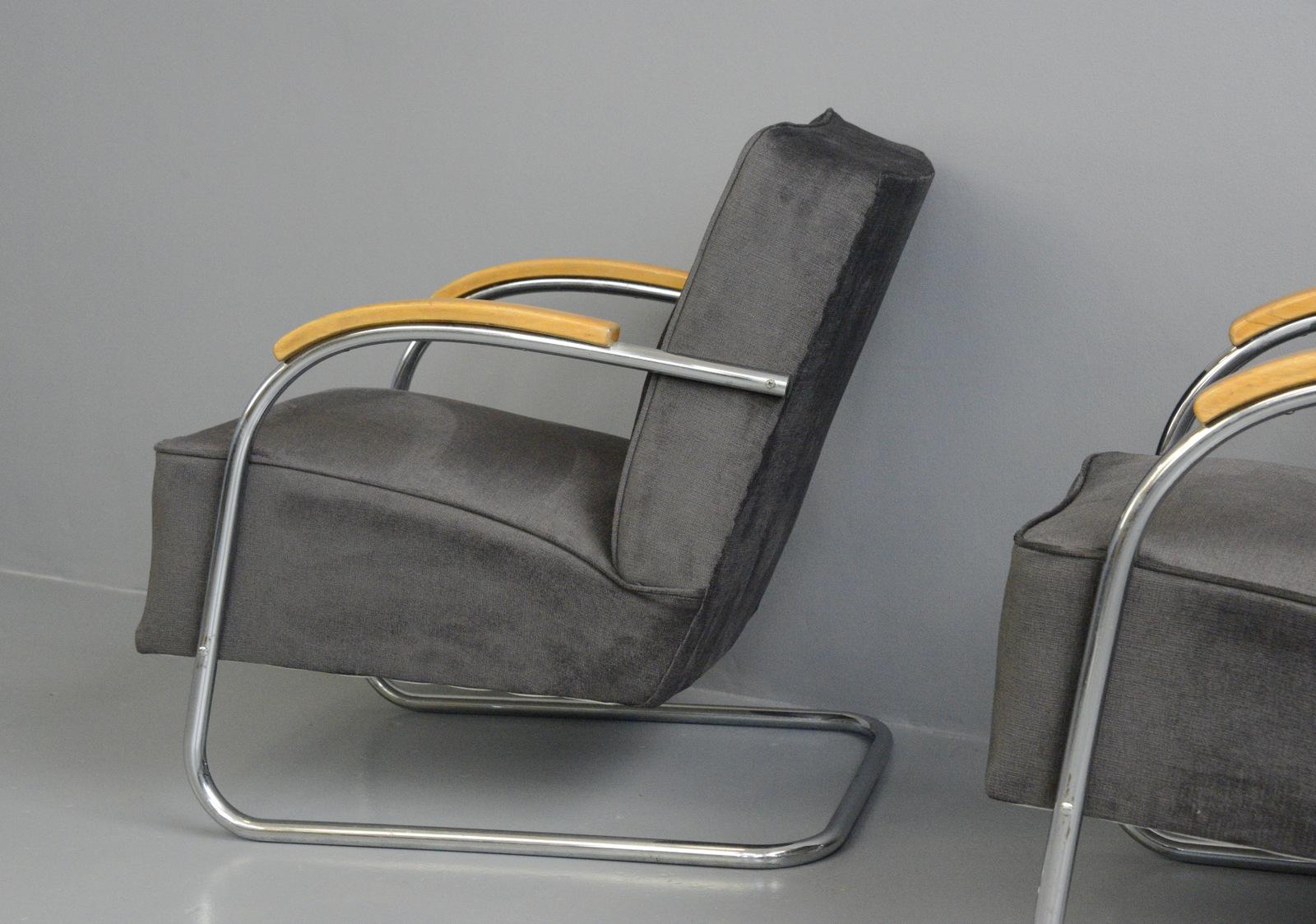 Bauhaus armchairs by Mücke Melder, circa 1930s.

- Price is for the pair
- Sprung seats and back rest
- Chrome-plated tubular steel cantilever frames
- New dark charcoal velvet upholstery
- Model FN21
- Produced by Mücke Melder
- Czech,