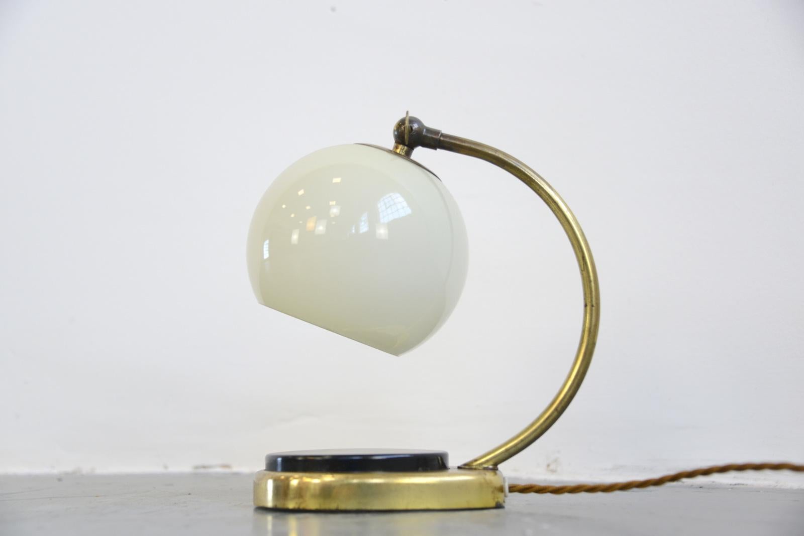 Bauhaus bedside lamp by Marianne Brandt, circa 1930s

- Brass base and arm
- Large bakelite touch switch
- Original opaline globe shade
- Takes e27 fitting bulbs
- Designed by Marianne Brandt
- Made by Ruppel, Gotha
- Known as the
